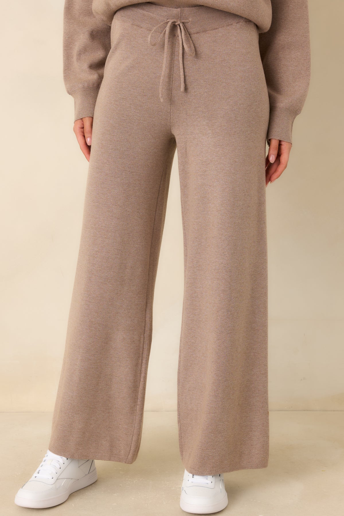 Washed knit pants with straight wide legs and a smooth drape through the fabric.