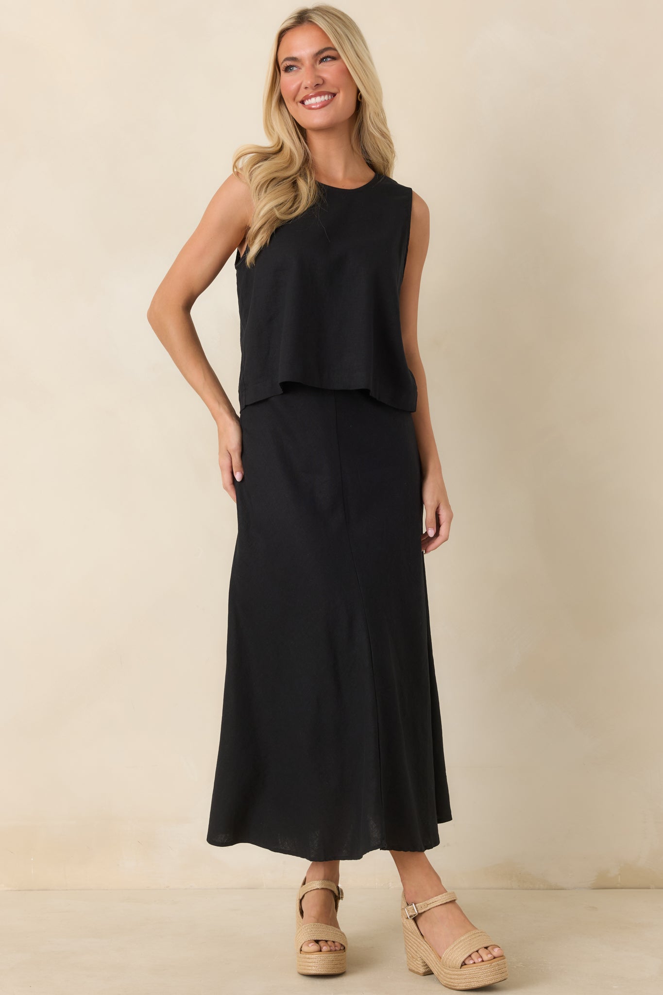 Washed linen-rayon midi skirt featuring a high-rise fit, elastic waistband, soft drape, and lightweight flowing silhouette.
