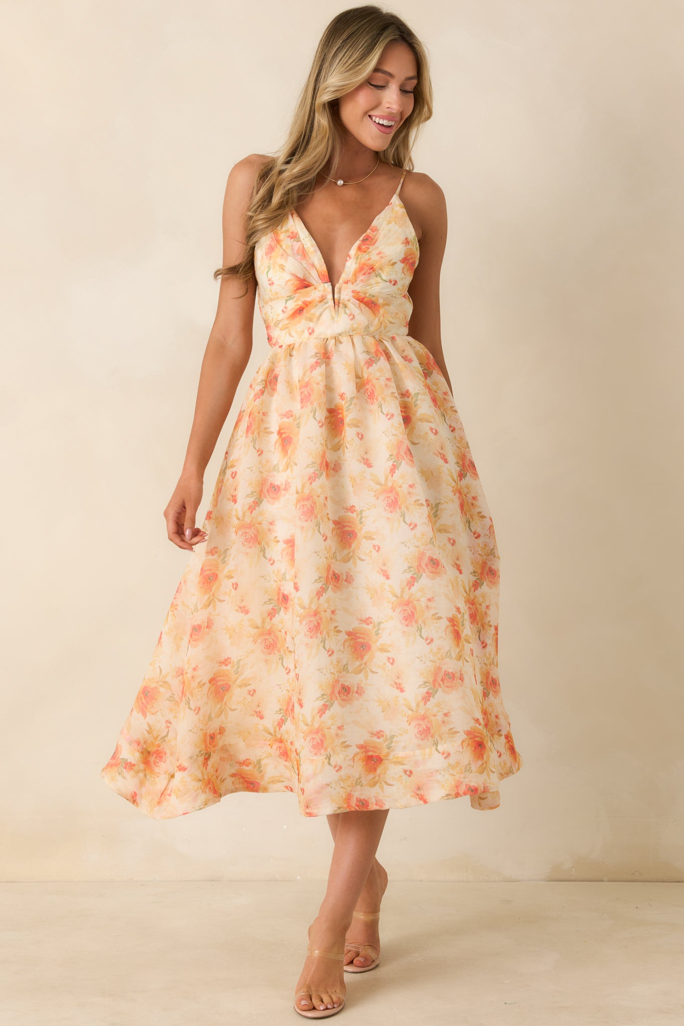 Watercolor floral midi dress with a breezy fit, midi-length hemline, and fluid drape throughout the skirt.