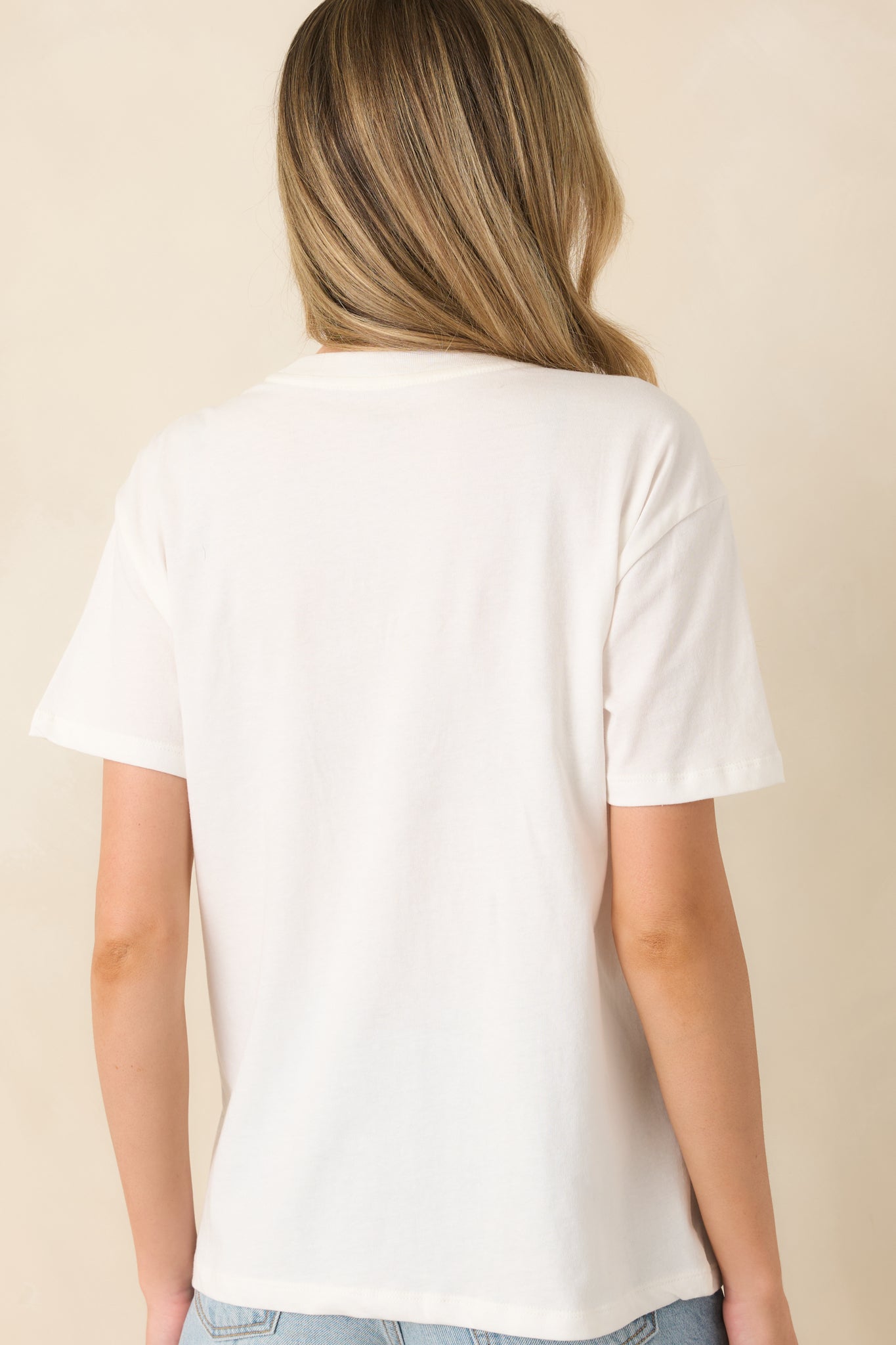 White boyfriend tee rear view with relaxed fit and subtle embroidered detailing.