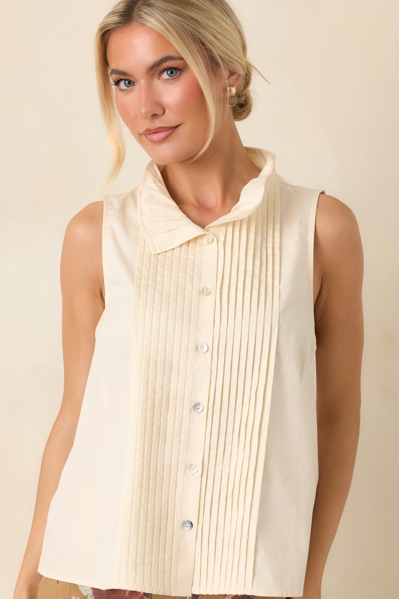 White button-front top featuring delicate pintuck detailing and lightweight cotton fabric for an effortlessly polished look.