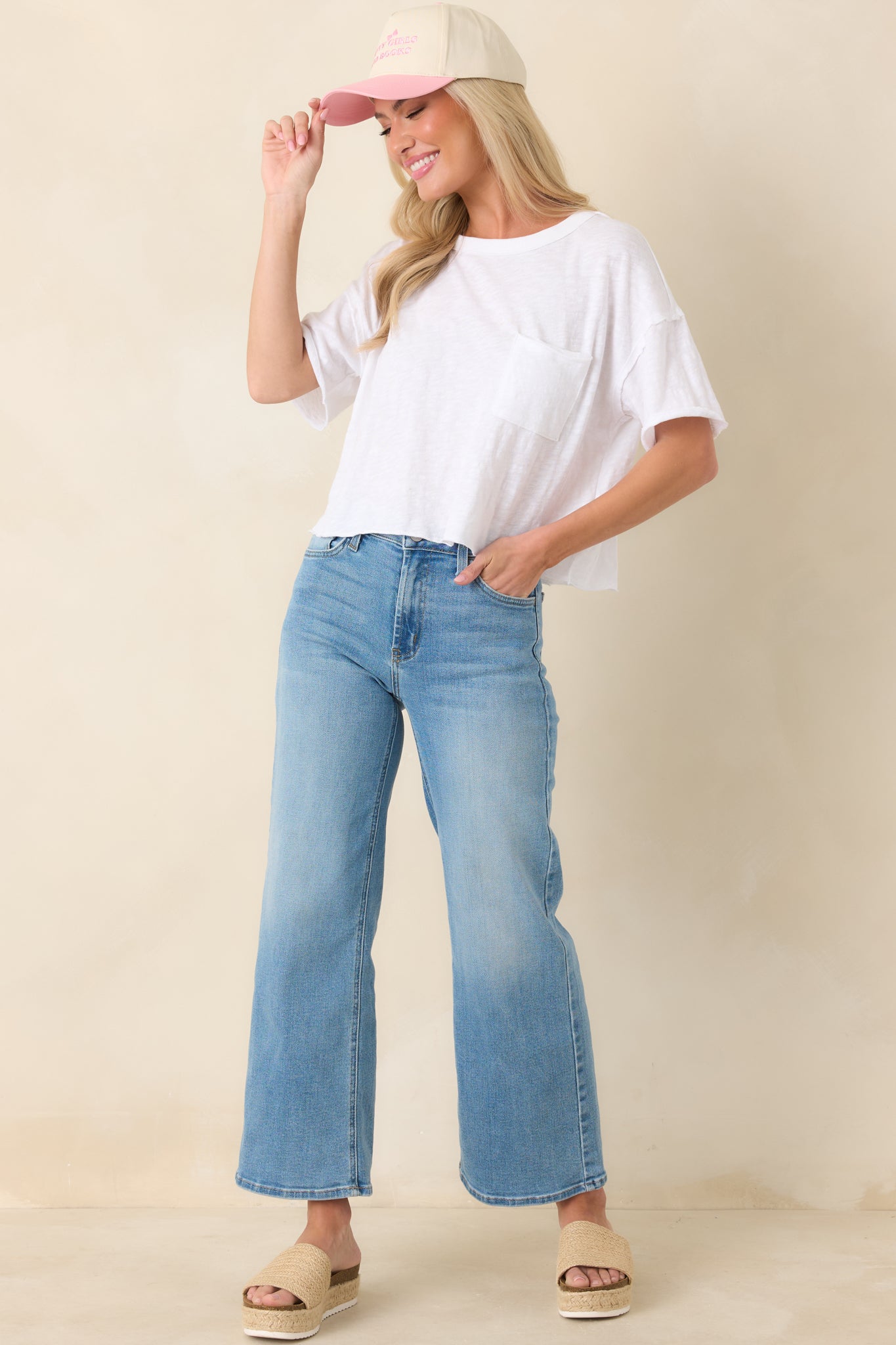 White cotton tee with a classic crew neckline, short sleeves, relaxed fit, and slightly cropped length for a modern, easy silhouette.