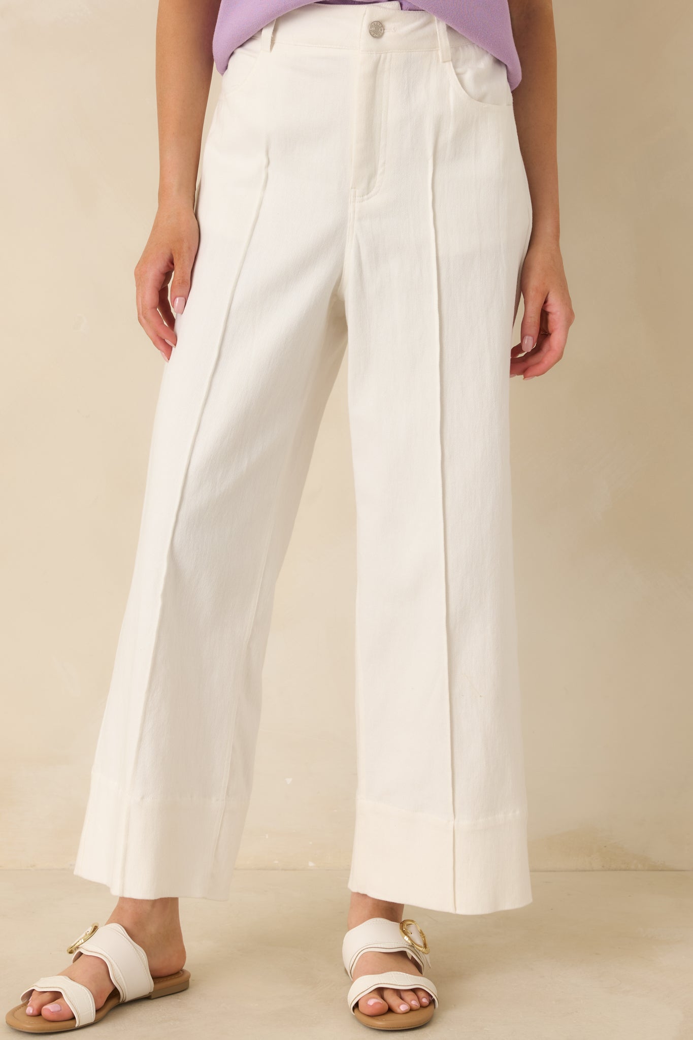 White cotton-stretch pants with a high-rise waist and effortless wide-leg drape.