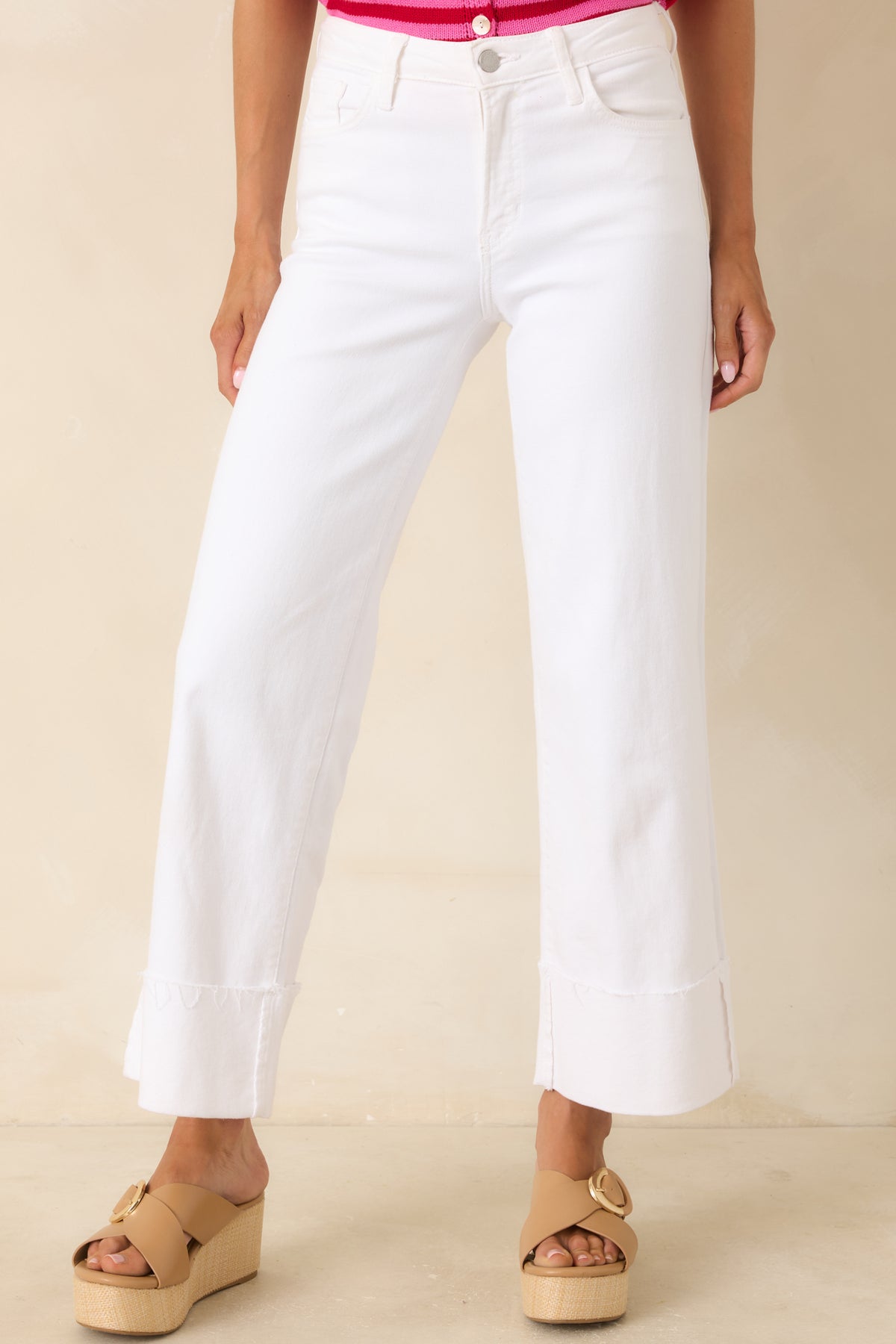 White denim pants featuring classic five-pocket styling, soft stretch fabric, and wide-leg construction.