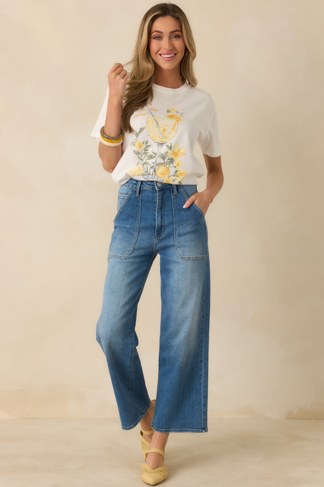 White graphic tee with a classic crew neckline, lightweight cotton fabric, and a casual relaxed fit.