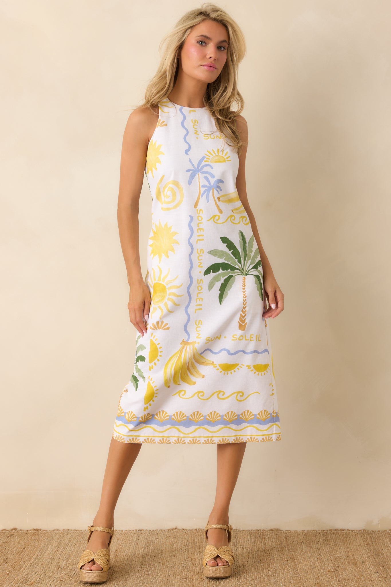 White linen-blend tank top featuring a tropical print, square neckline, and wide shoulder straps with a relaxed, slightly cropped silhouette.