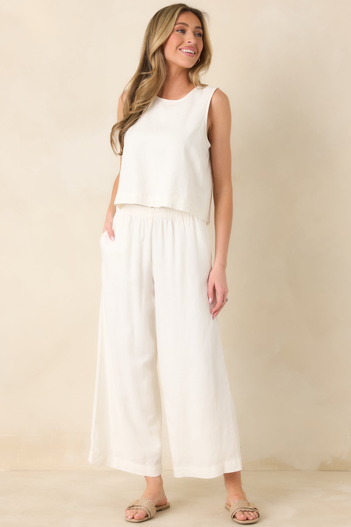 Lightweight linen-blend tank in white with a relaxed fit, clean round neckline, and versatile hip-length hem.