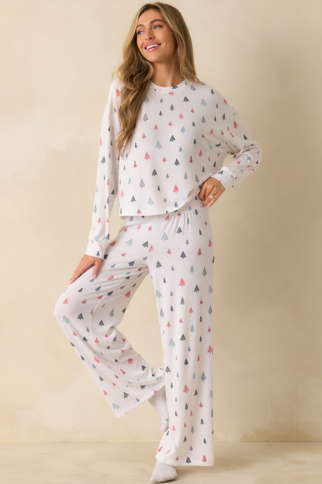 White long-sleeve pajama top in brushed sweater knit with relaxed fit, crew neckline, and allover alpine tree print.