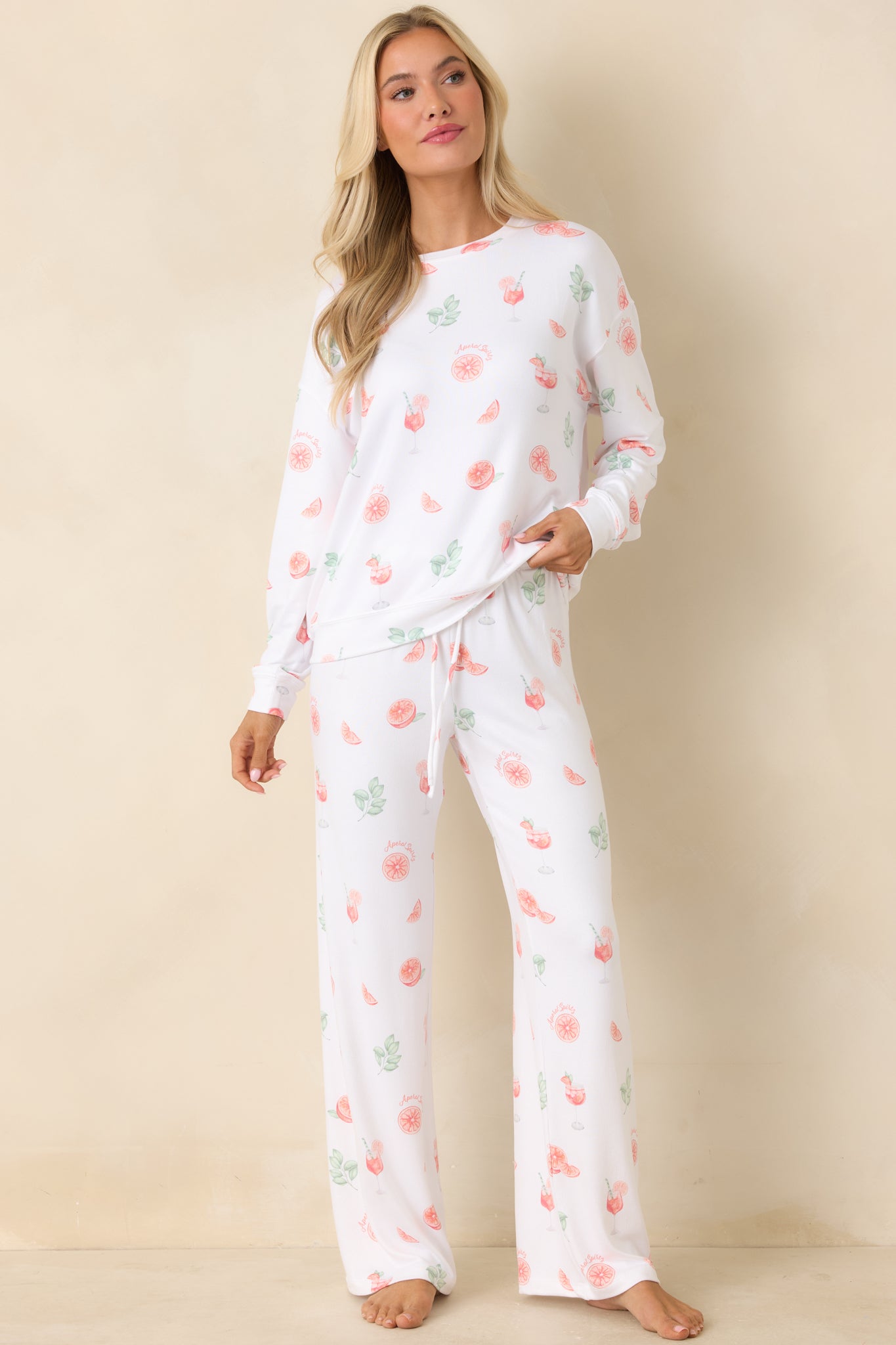 White long sleeve pajama top with playful citrus and cocktail print, and an easy relaxed fit.