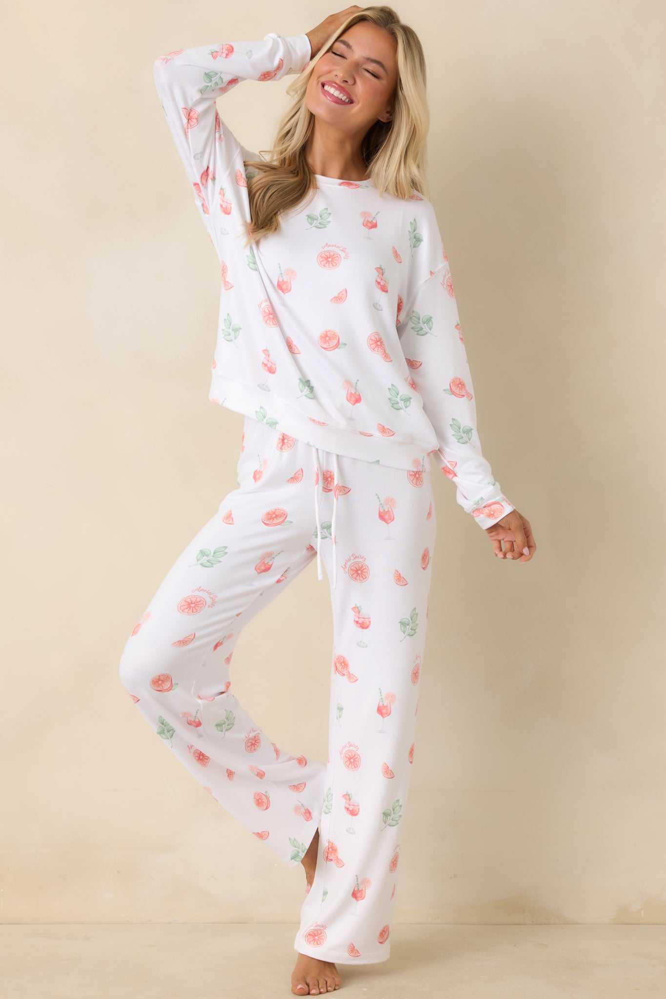 White long sleeve sleep top with allover citrus motif and easy, relaxed silhouette.