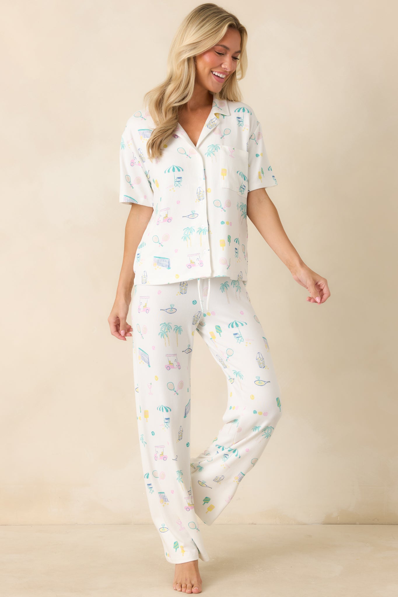 Comfortable white lounge pants showcasing a playful sports-inspired pattern, lightweight feel, and adjustable drawstring waist.
