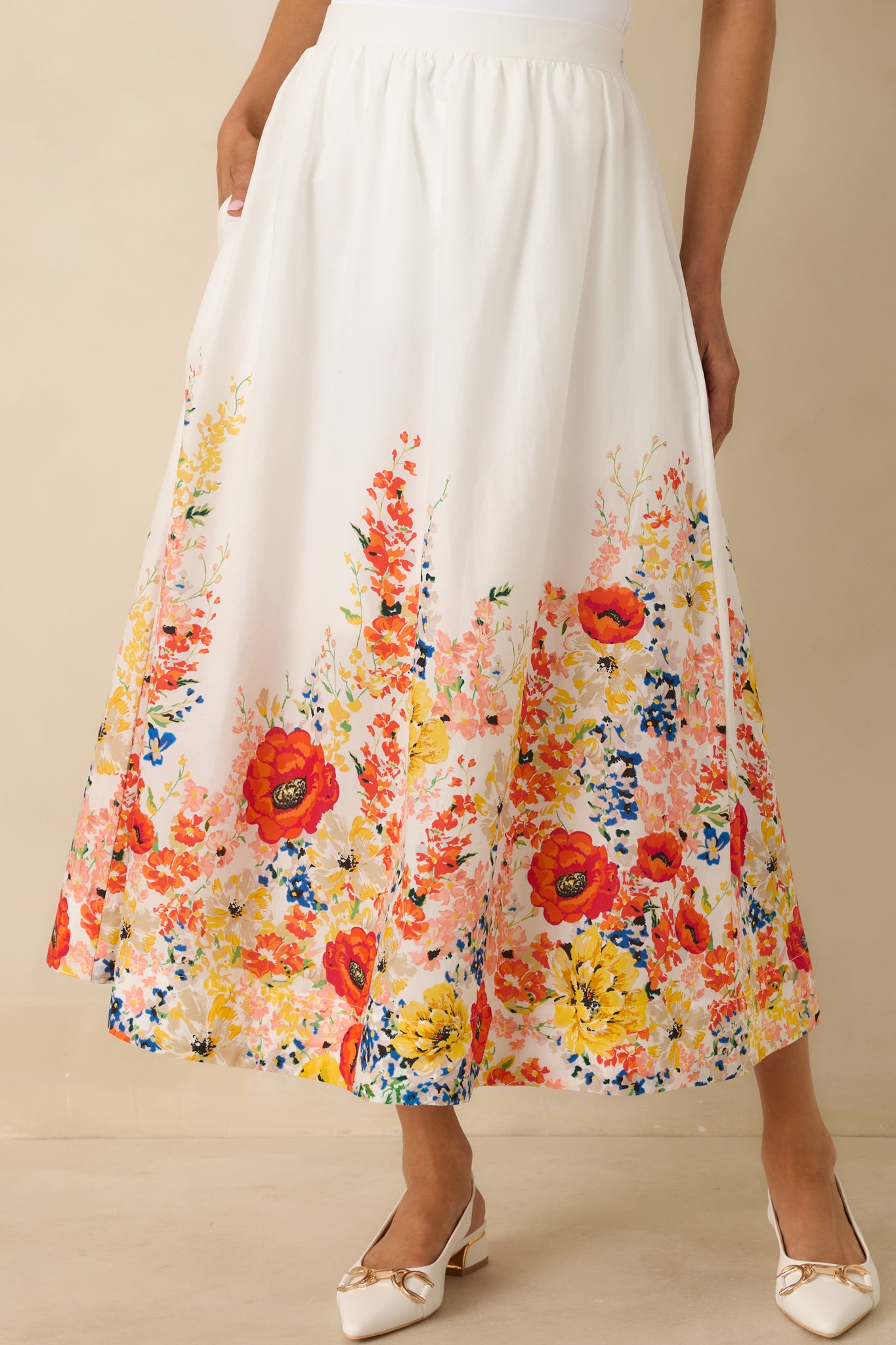 White maxi skirt highlighting the high-rise elastic waistband and soft, lightweight cotton fabric.