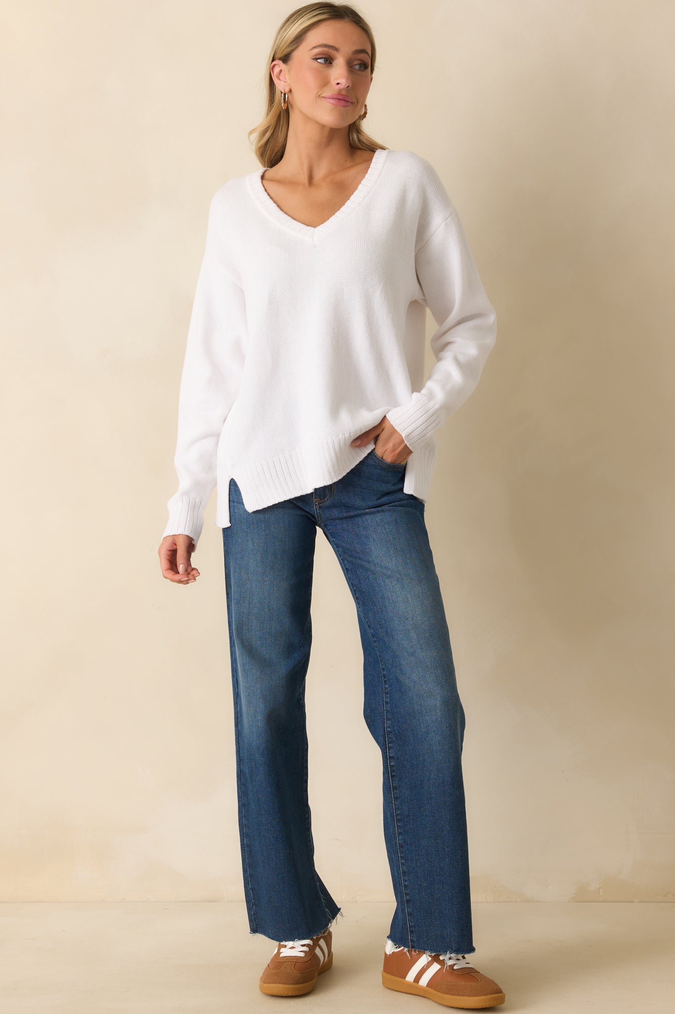 Cotton sweater in white with long drop shoulder sleeves, soft drape, and ribbed edges