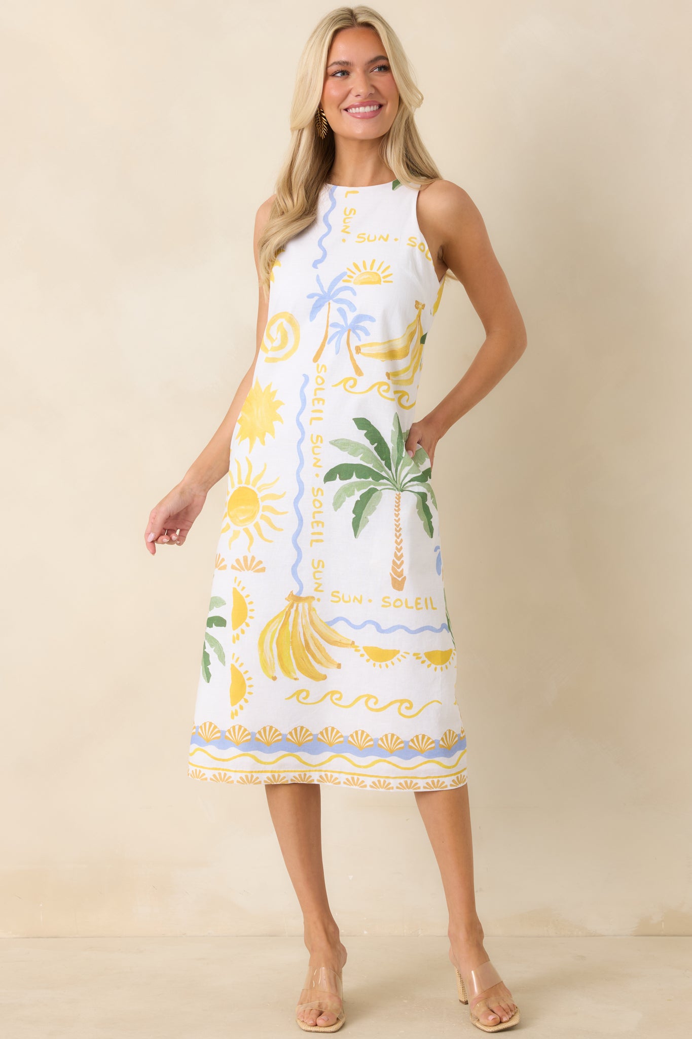White sleeveless top featuring a square neckline and relaxed fit, designed with a vibrant tropical motif for a fresh, warm-weather look.