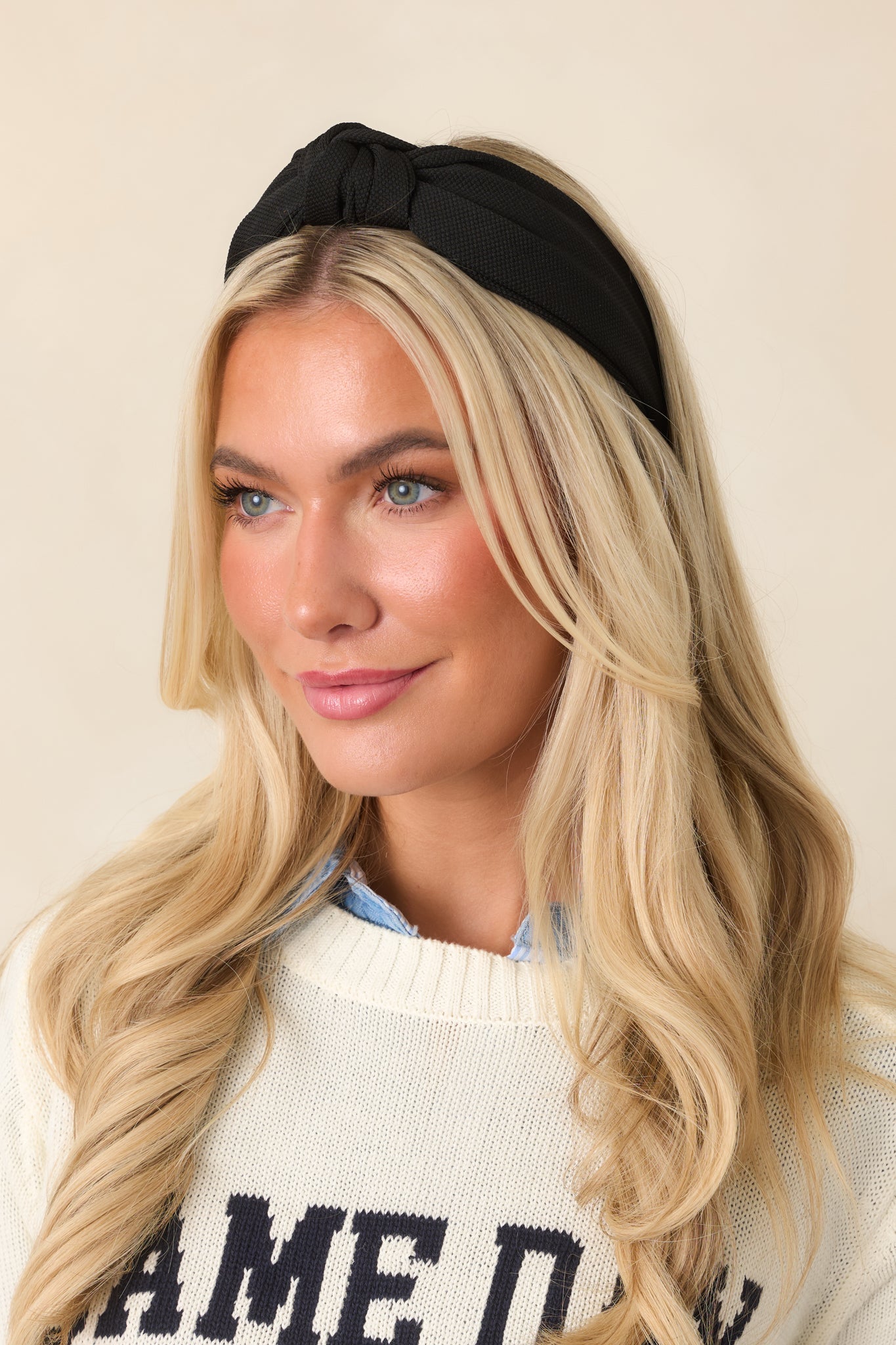 Wide-band headband featuring a polished design and a structured shape for a comfortable, secure fit.