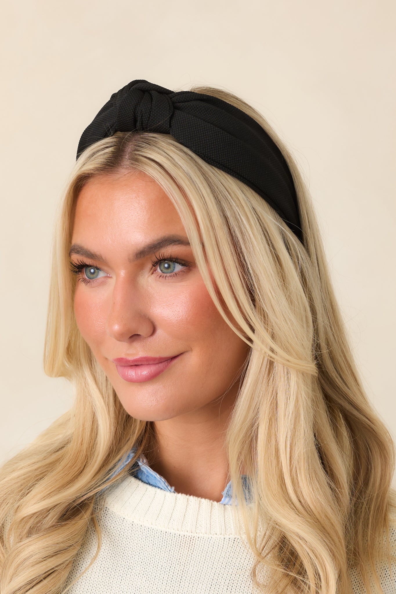 Close-up of the wide headband highlighting its smooth finish, substantial band, and neatly structured design.