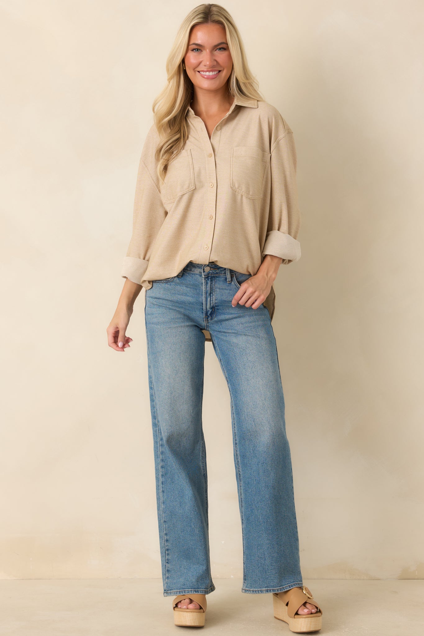 Wide leg denim jeans designed with functional front and back pockets in a classic medium wash finish.