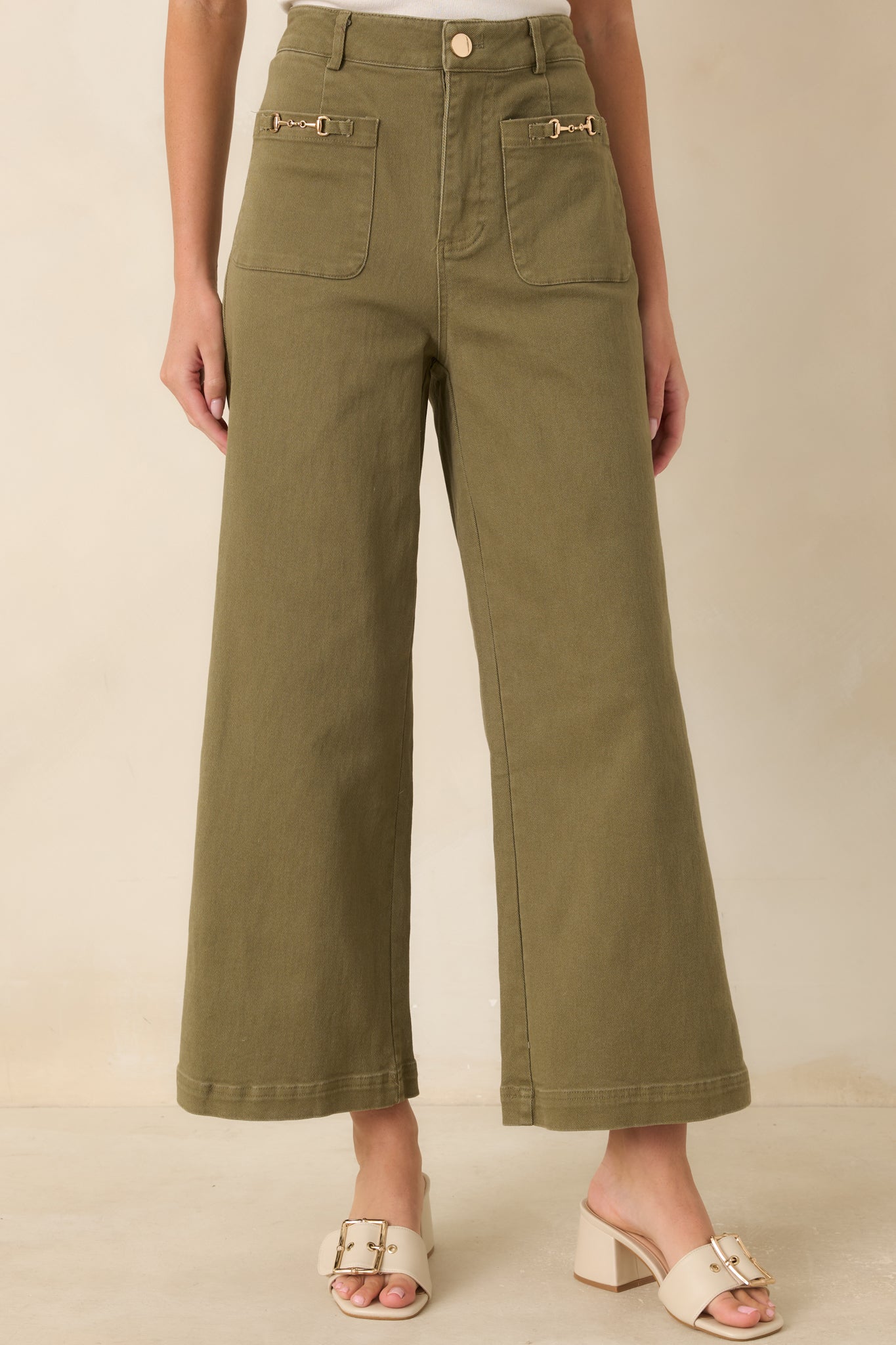 Wide leg denim construction pairs with ankle-length hems for a modern, tailored appearance.