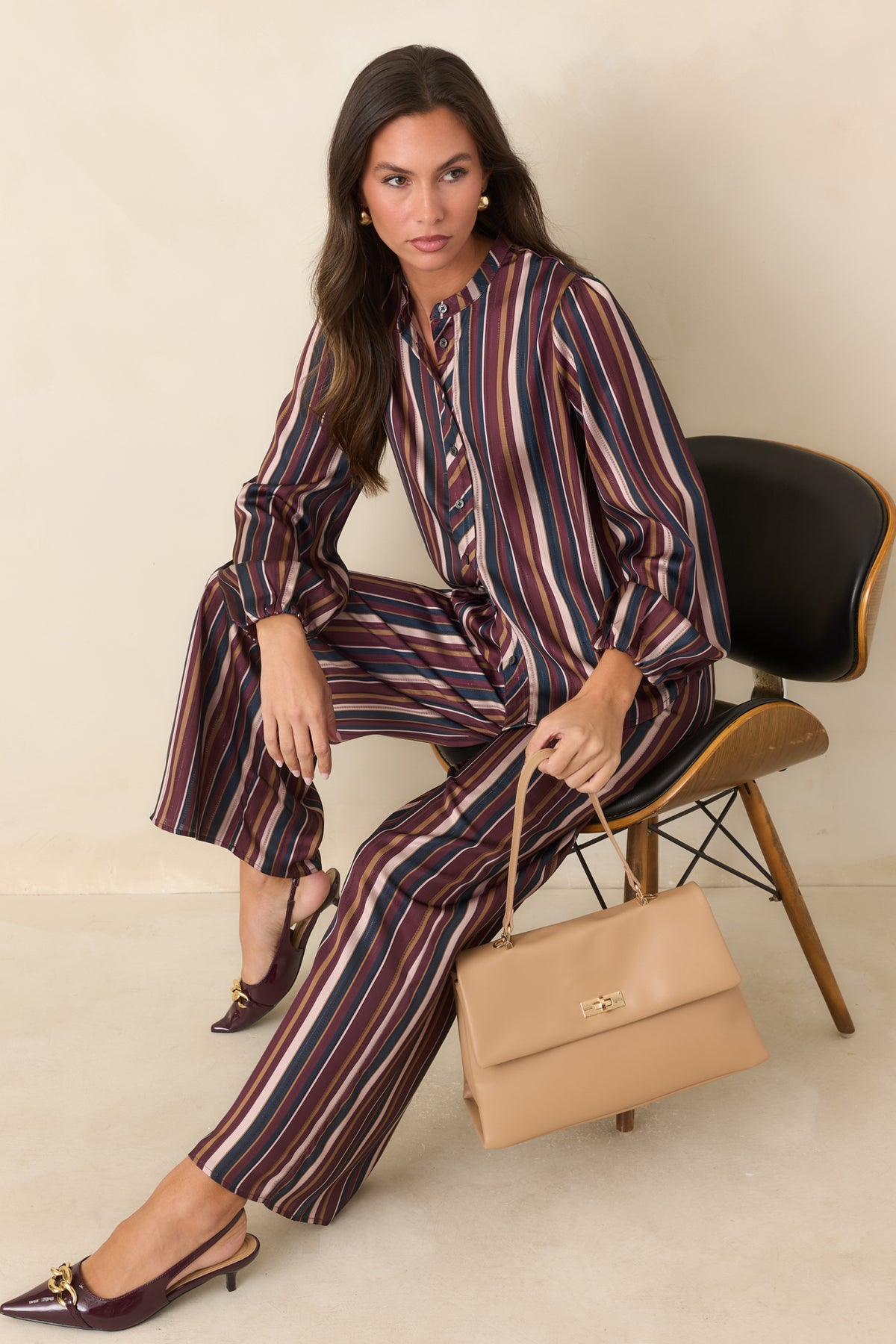  Wide leg pants featuring a comfortable elastic waistband and flowing satin construction.