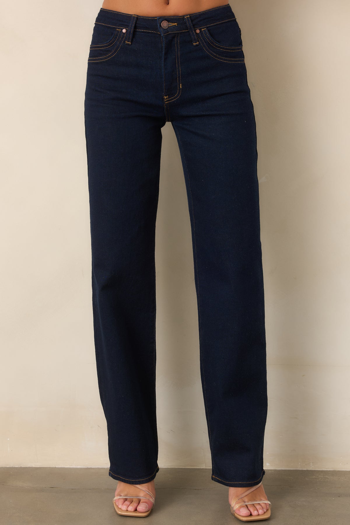 Wide-leg jeans featuring distinctive double-row stitching along the front pockets.
