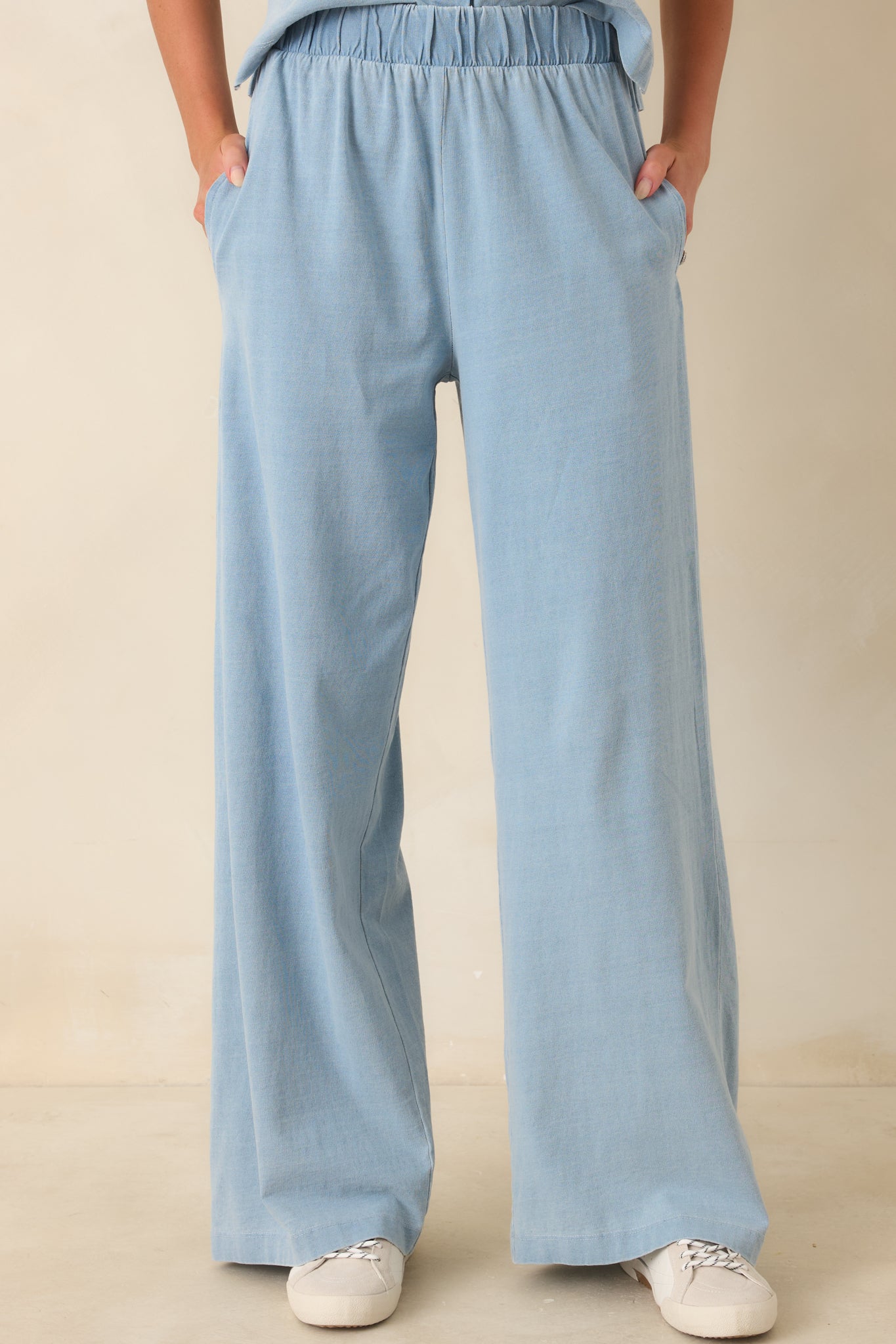 Wide leg lounge pants in light denim blue with breathable cotton fabric and a comfortable relaxed drape.