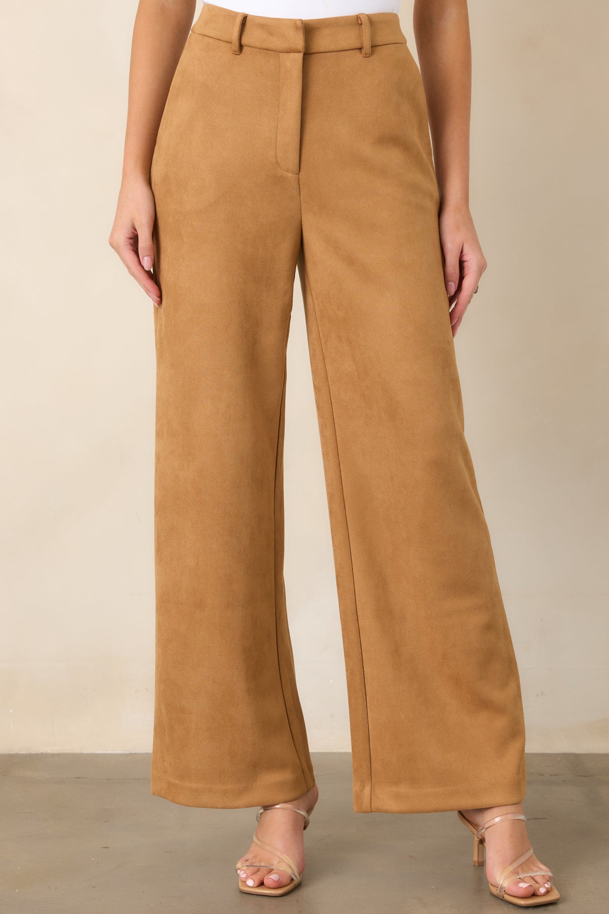 Detailed view of the pants showcasing the practical side pockets and smooth full-length wide-leg construction