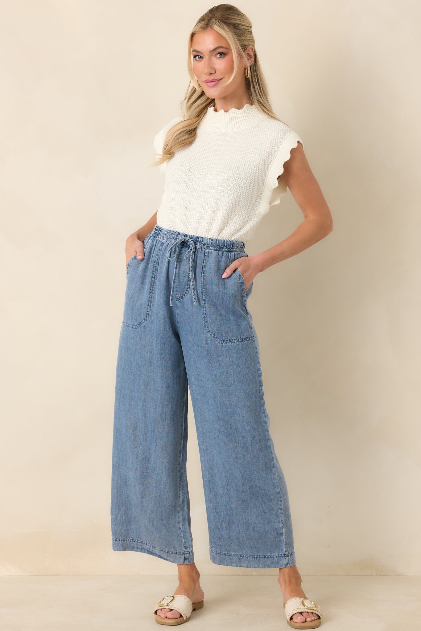Wide-leg pants with a relaxed pull-on fit, adjustable drawstring waist, and oversized front patch pockets.