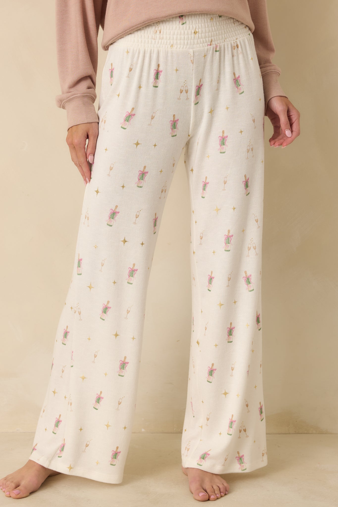 View highlighting the wide-leg shape and soft ivory knit texture.