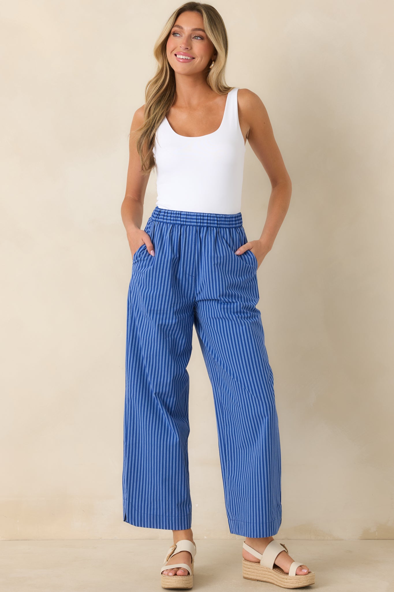 Wide-leg striped pants showcasing a comfortable pull-on design, soft drape, and functional side pockets.