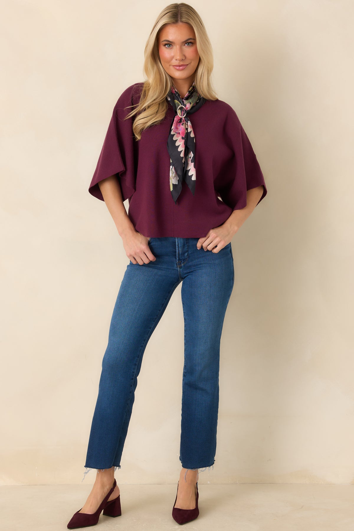 Wide-neck knit top with subtle ribbed trim, a relaxed fit, and a clean vertical seam down the front.