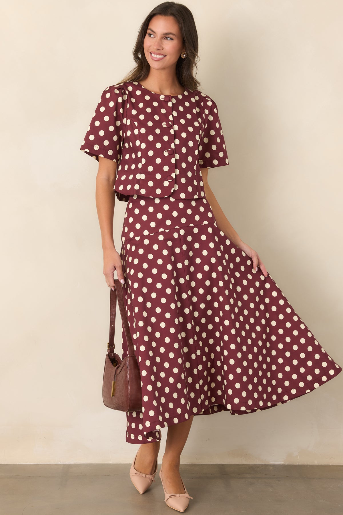 Wine cotton midi skirt with an ivory dotted print and fitted yoke at the waist.