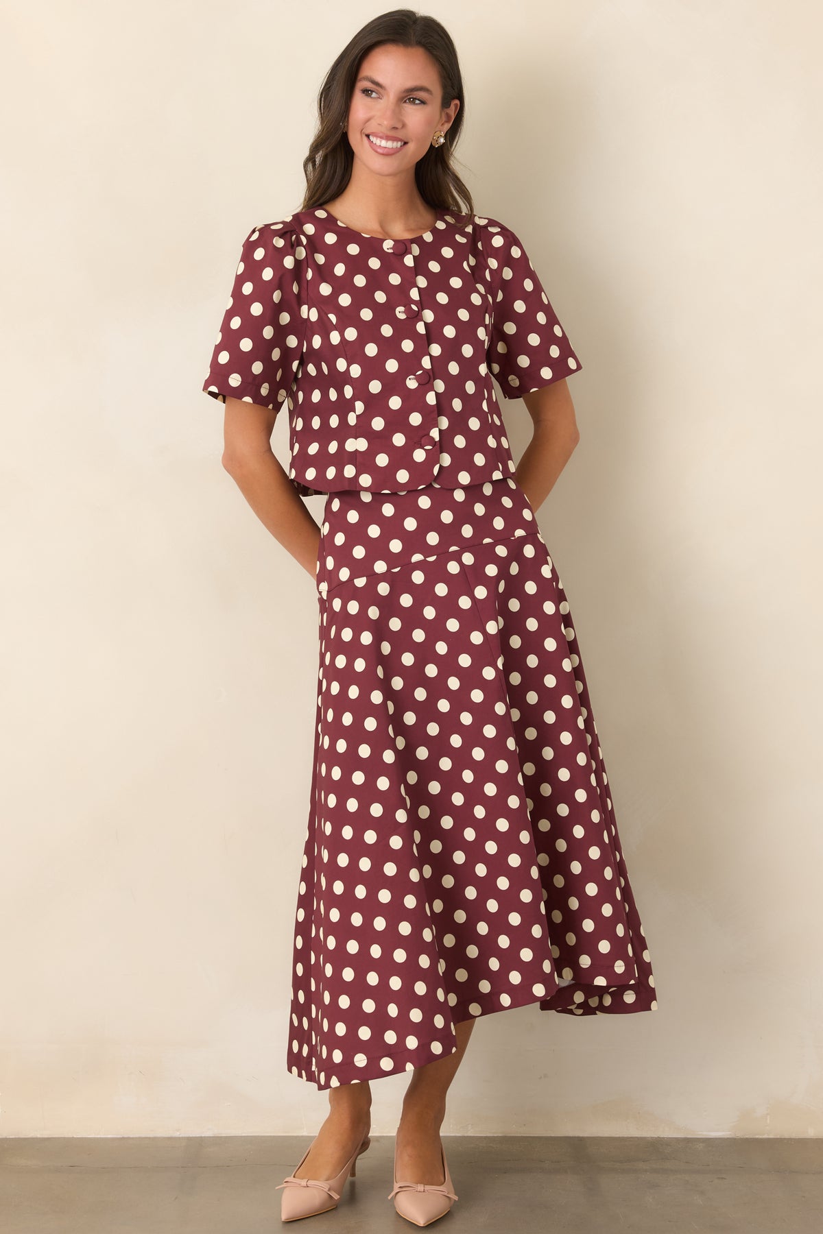 Rich wine cropped top with ivory polka dots, gathered shoulders, and a tailored bodice.