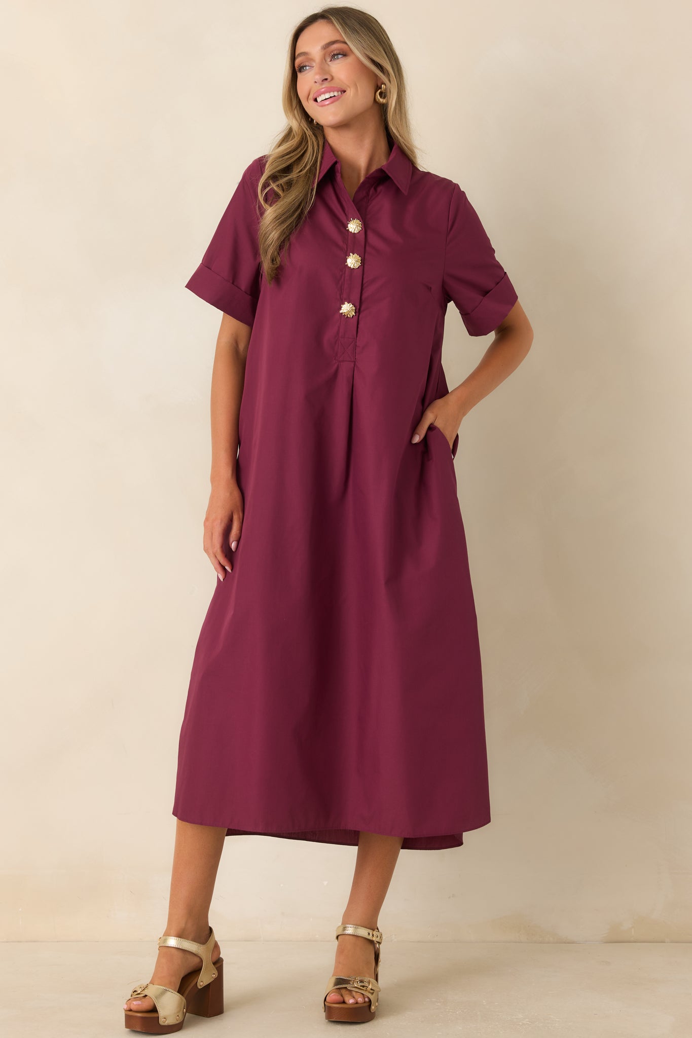 Rich wine red shirt dress with statement floral buttons, short sleeves, and a comfortable relaxed fit.