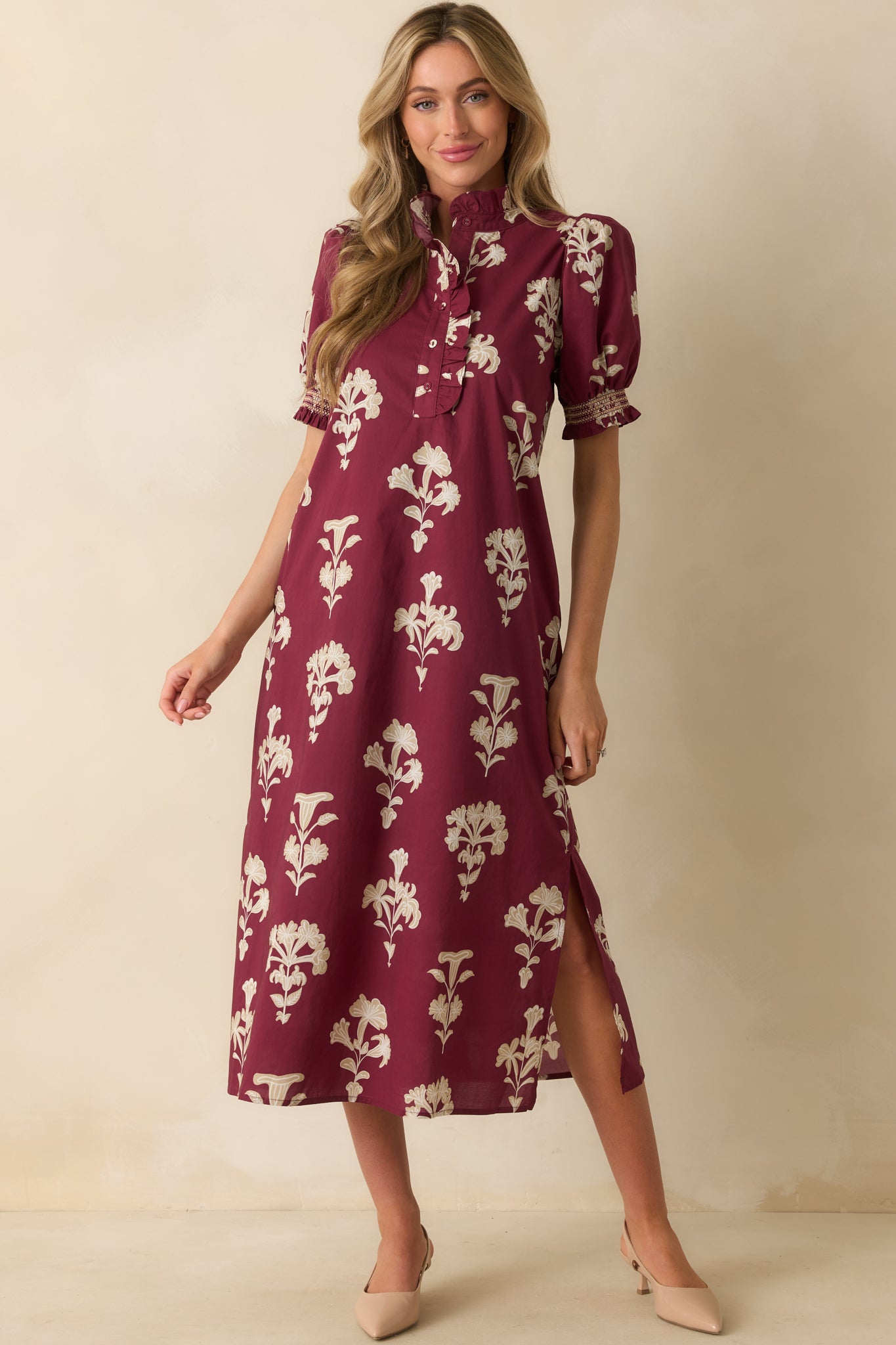 Wine red floral dress with side seam bottom hem slits and relaxed, flowing silhouette.