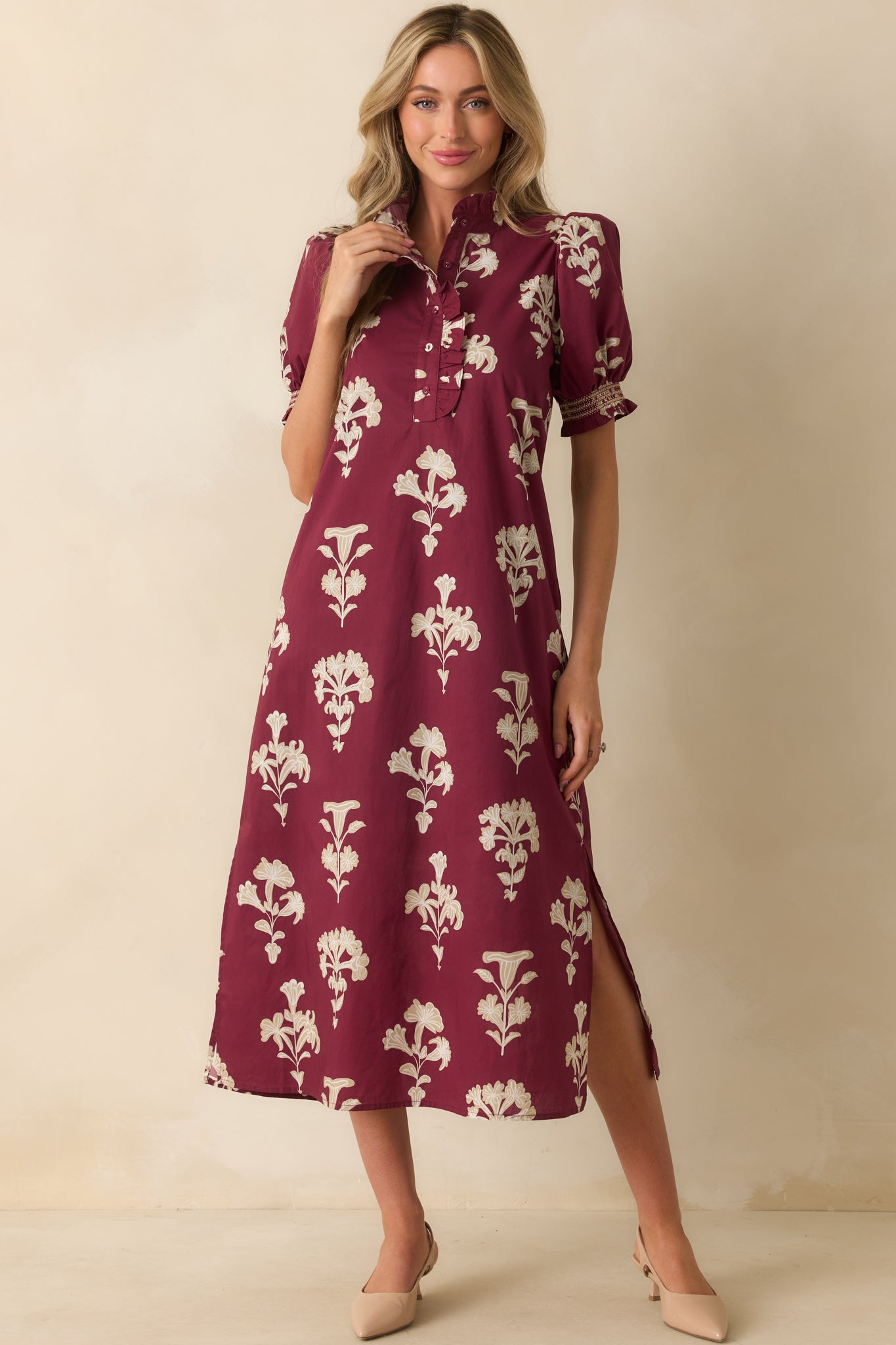 Maxi dress in wine red featuring smocked cuffs on puff sleeves and a quarter button front placket with ruffle trim