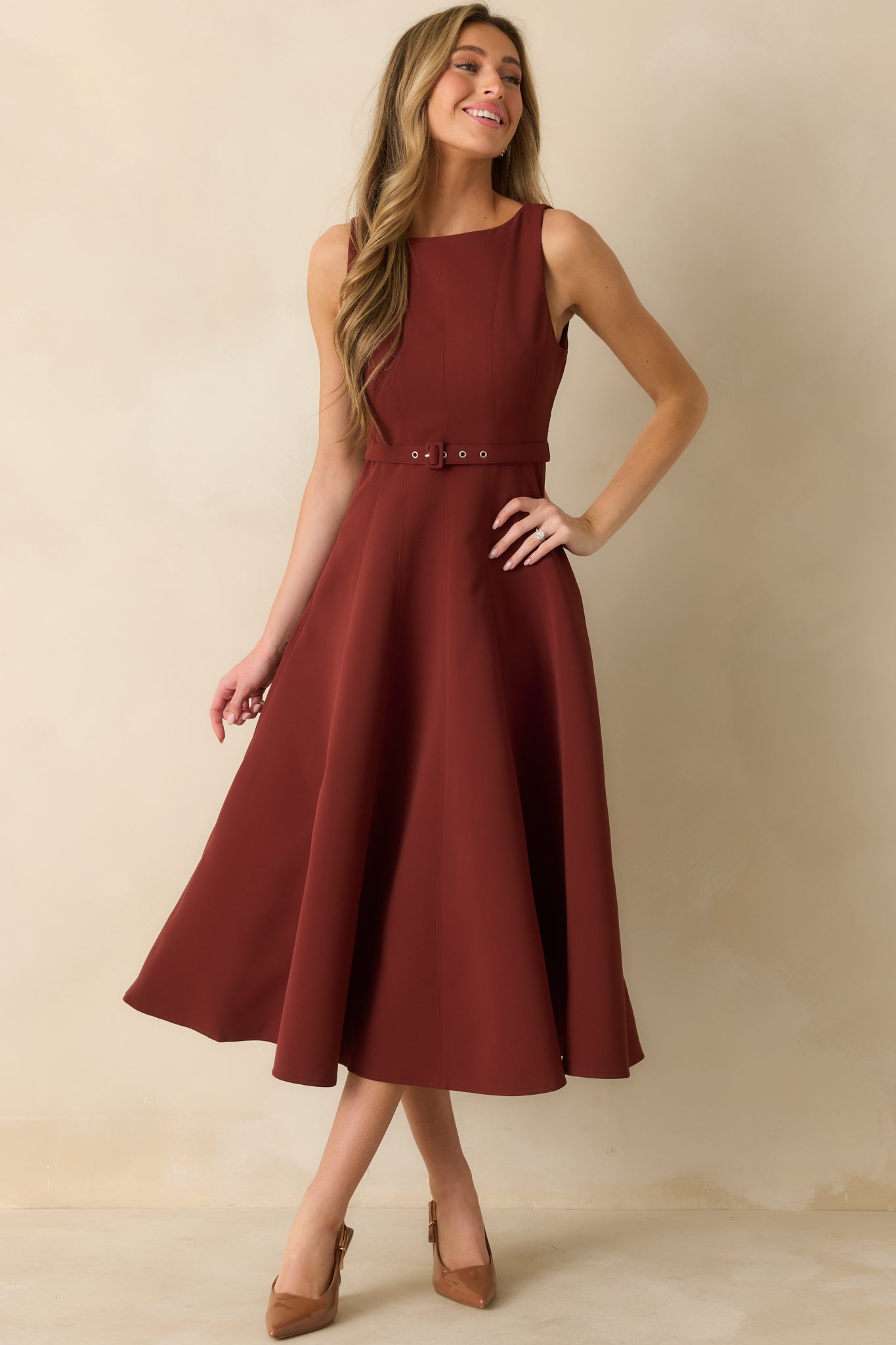 Wine red sleeveless midi dress with fitted seamed bodice and flared A-line skirt.