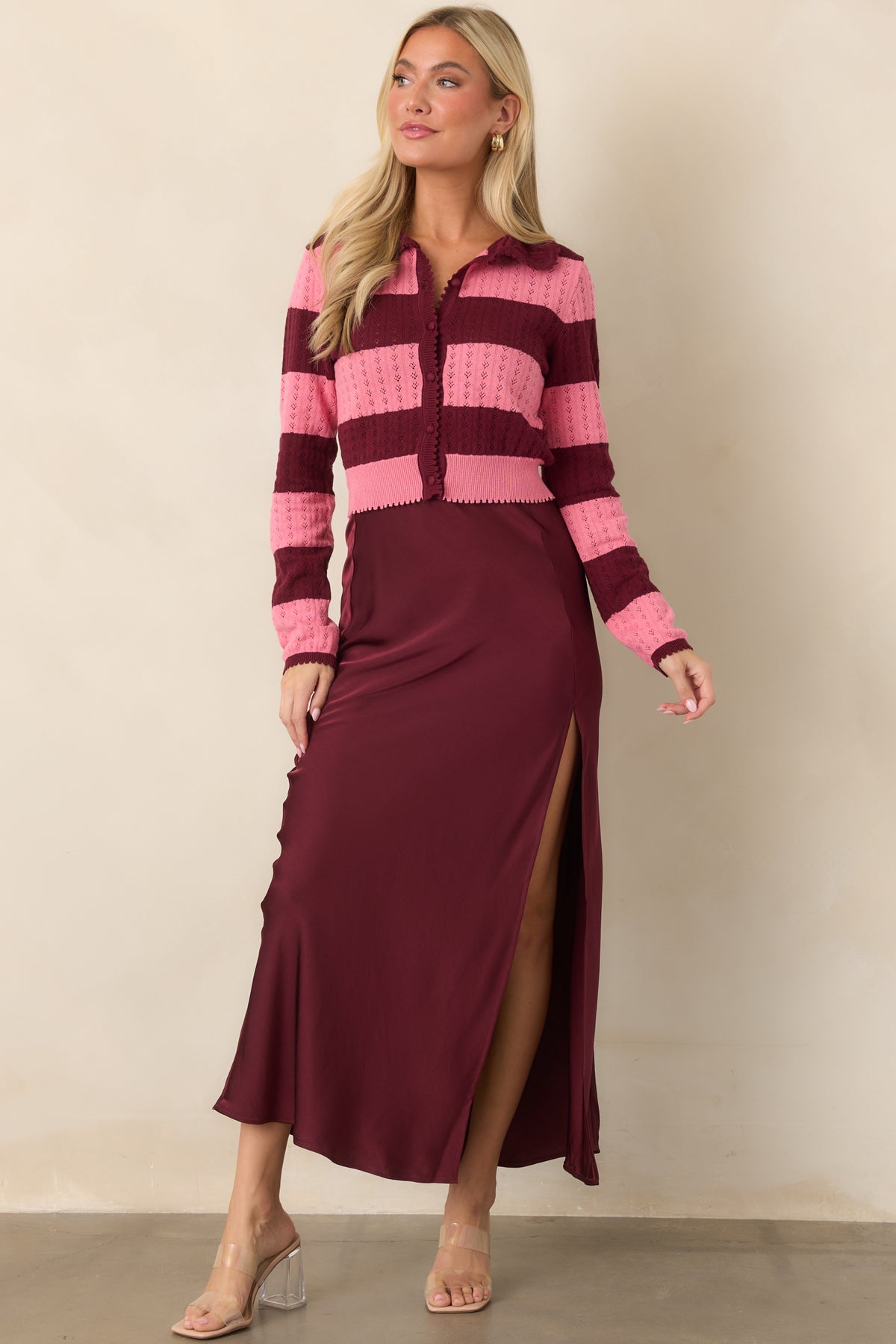 Fluid wine satin midi skirt with a smooth high-rise waistband and graceful A-line drape.