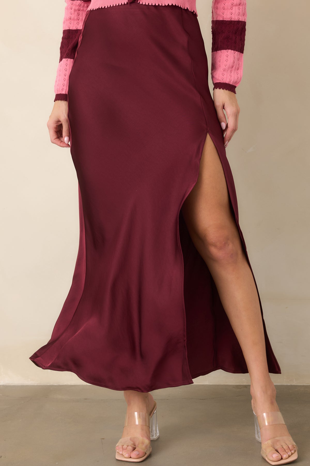 Close-up of the wine satin sheen, smooth high-rise waist, and pull-on waistband.