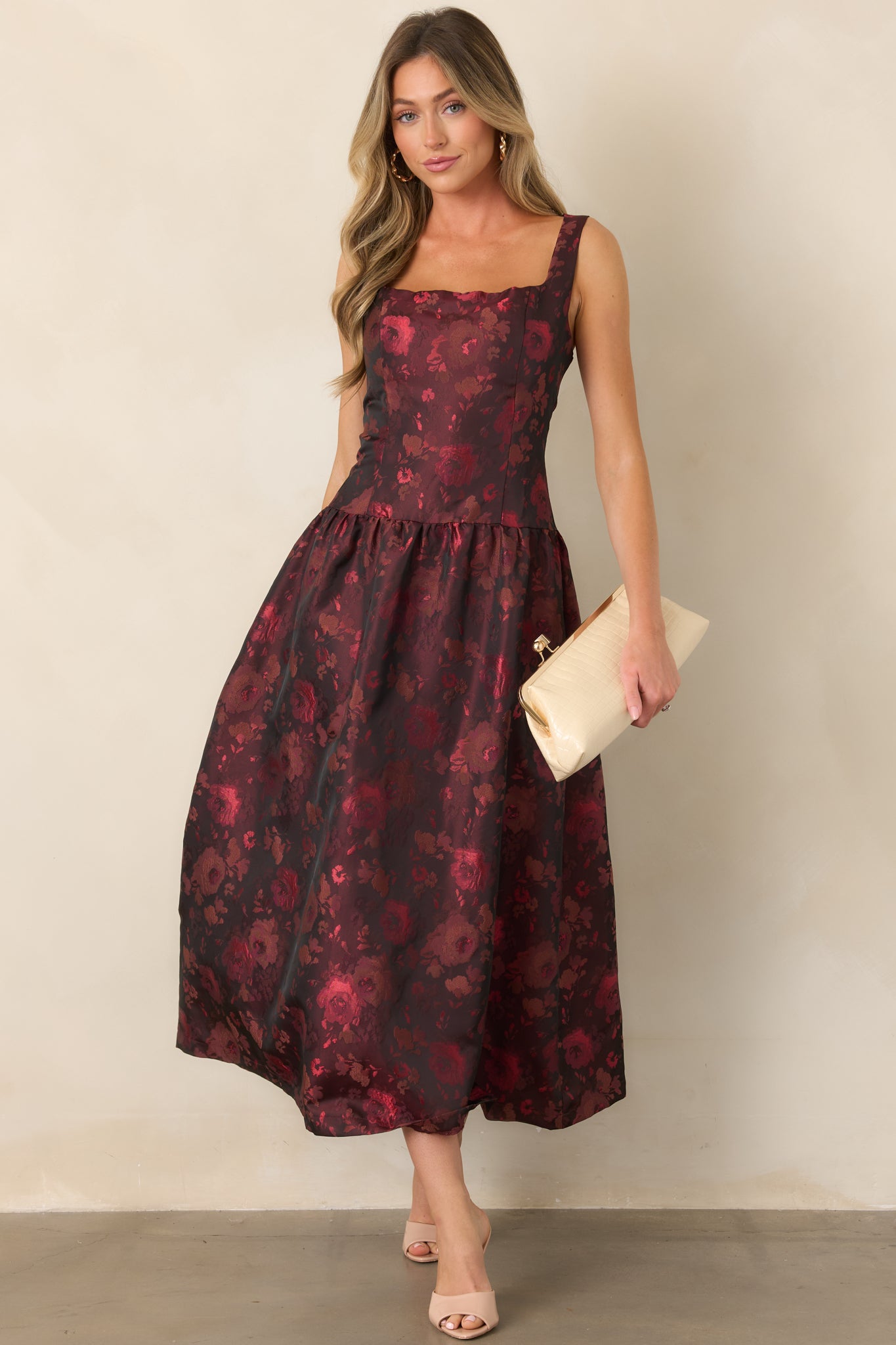 Woven floral midi dress featuring a fitted sleeveless bodice, square neckline, gathered full skirt, and classic fit-and-flare silhouette.