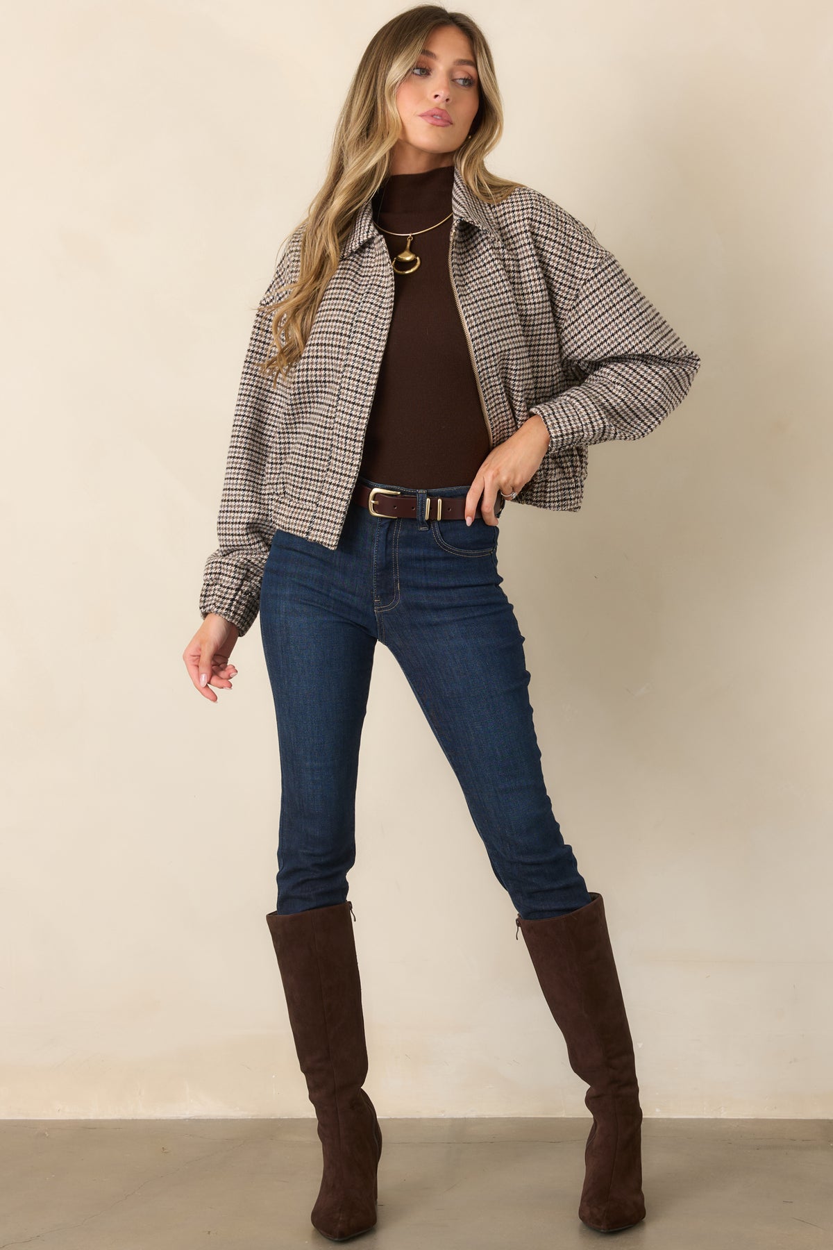 Smooth woven fabric gives this oversized houndstooth jacket a structured look with a tailored spread collar.