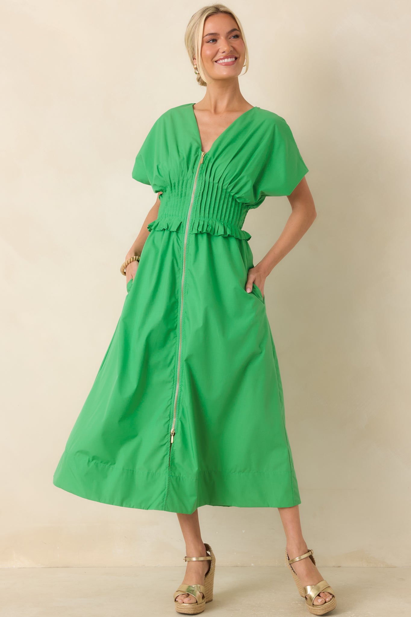 Woven maxi dress with short sleeves, wide smocked waist, and practical side pockets.