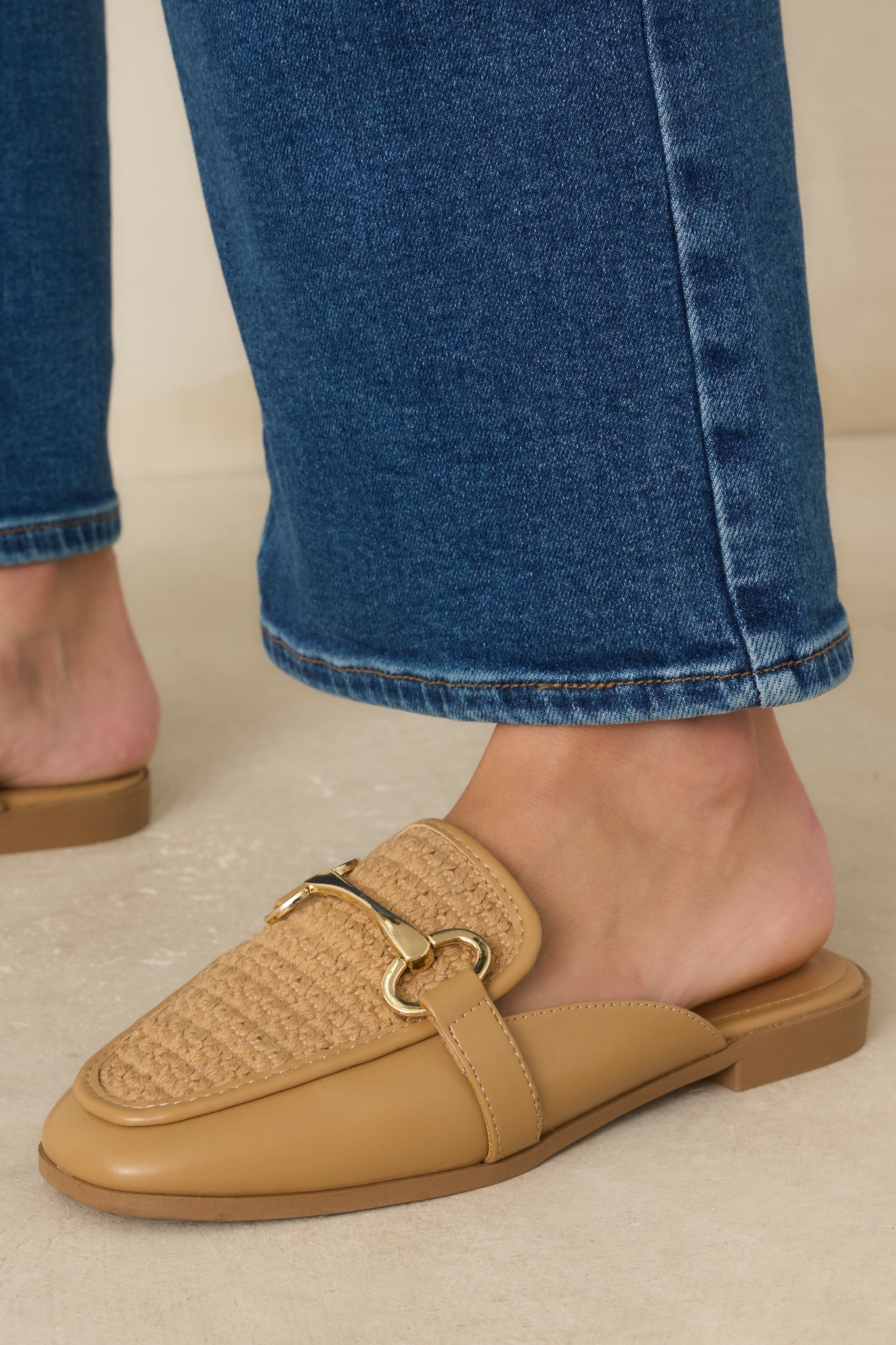 Woven slip-on loafers showcasing a dimensional textured upper and refined gold-tone accent for an elevated finish.