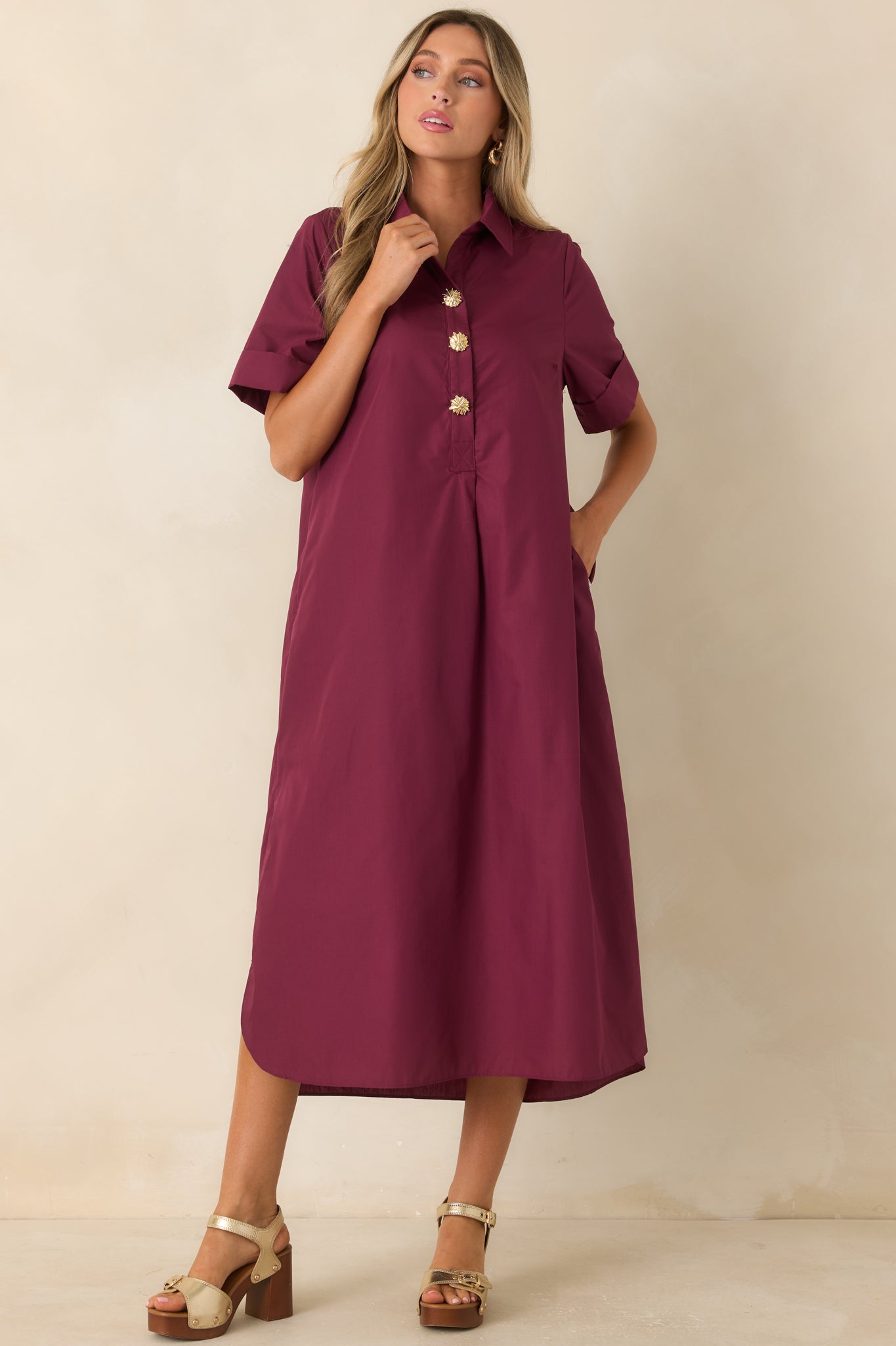Woven maxi dress showcasing a partial button-front placket, side pockets, side slits, and effortless flowing movement.