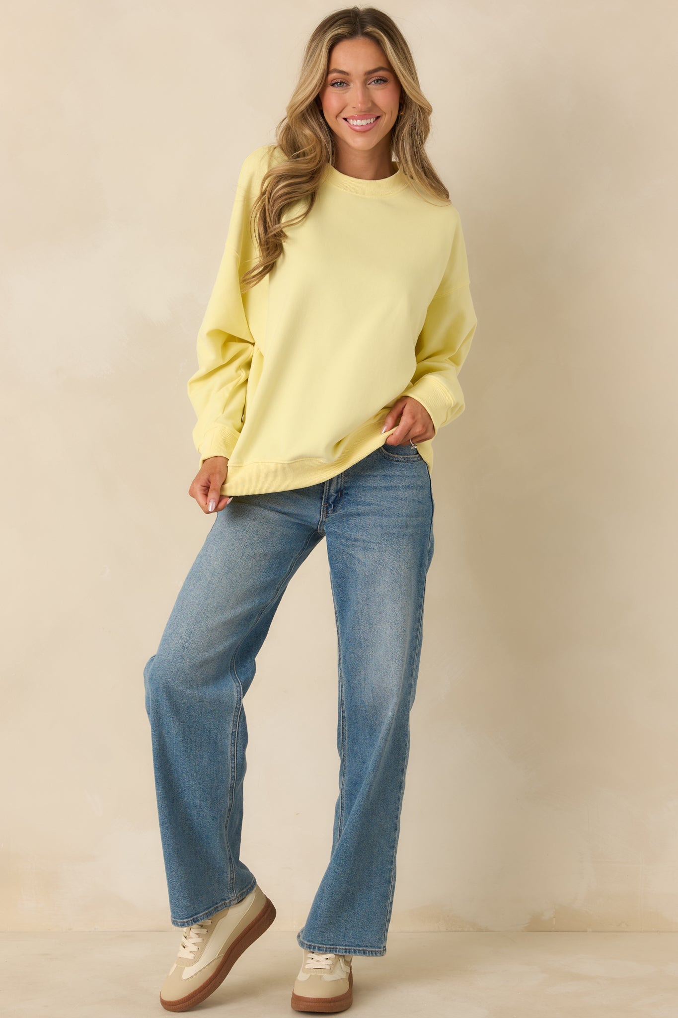 Classic yellow crewneck sweatshirt with a relaxed fit and soft knit fabric.