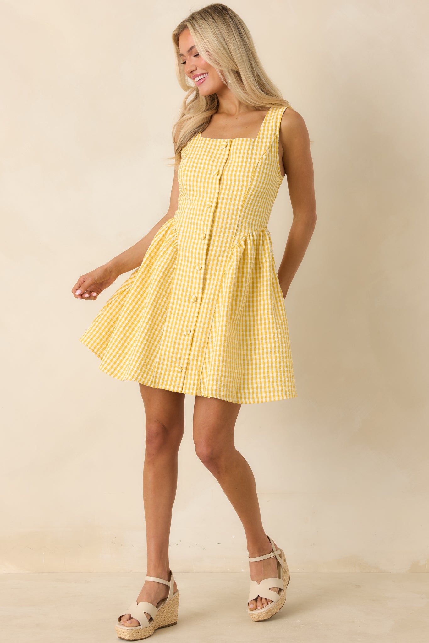 Yellow gingham dress with flattering square neckline and relaxed, easy drape.