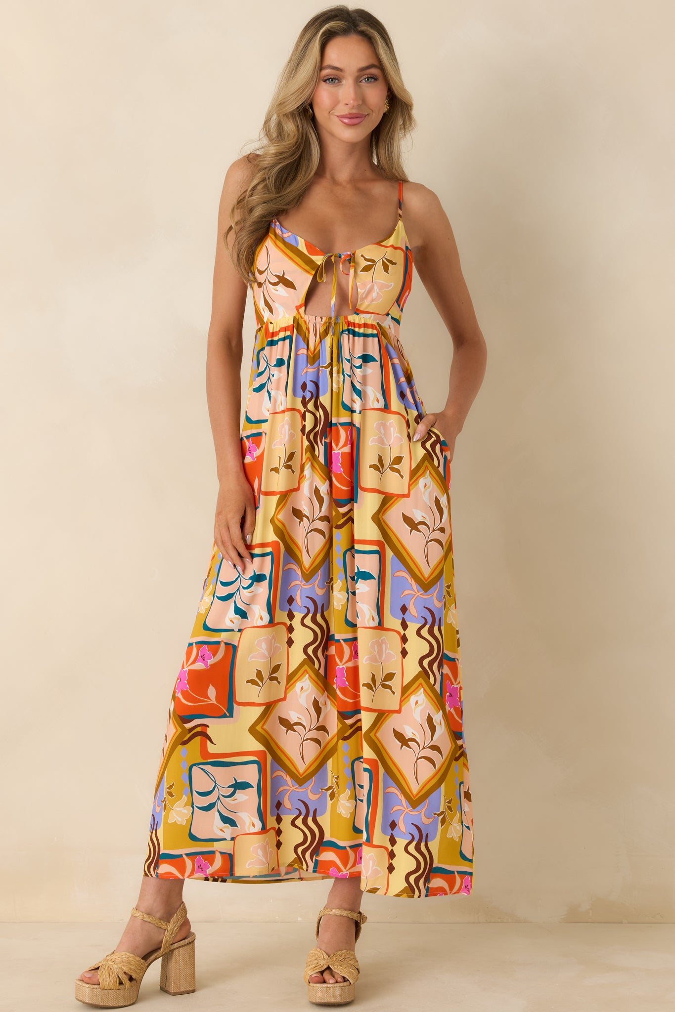Yellow multi midi dress with a bold scarf-inspired print, lightweight woven fabric, and a flowy silhouette with an adjustable spaghetti-strap design.