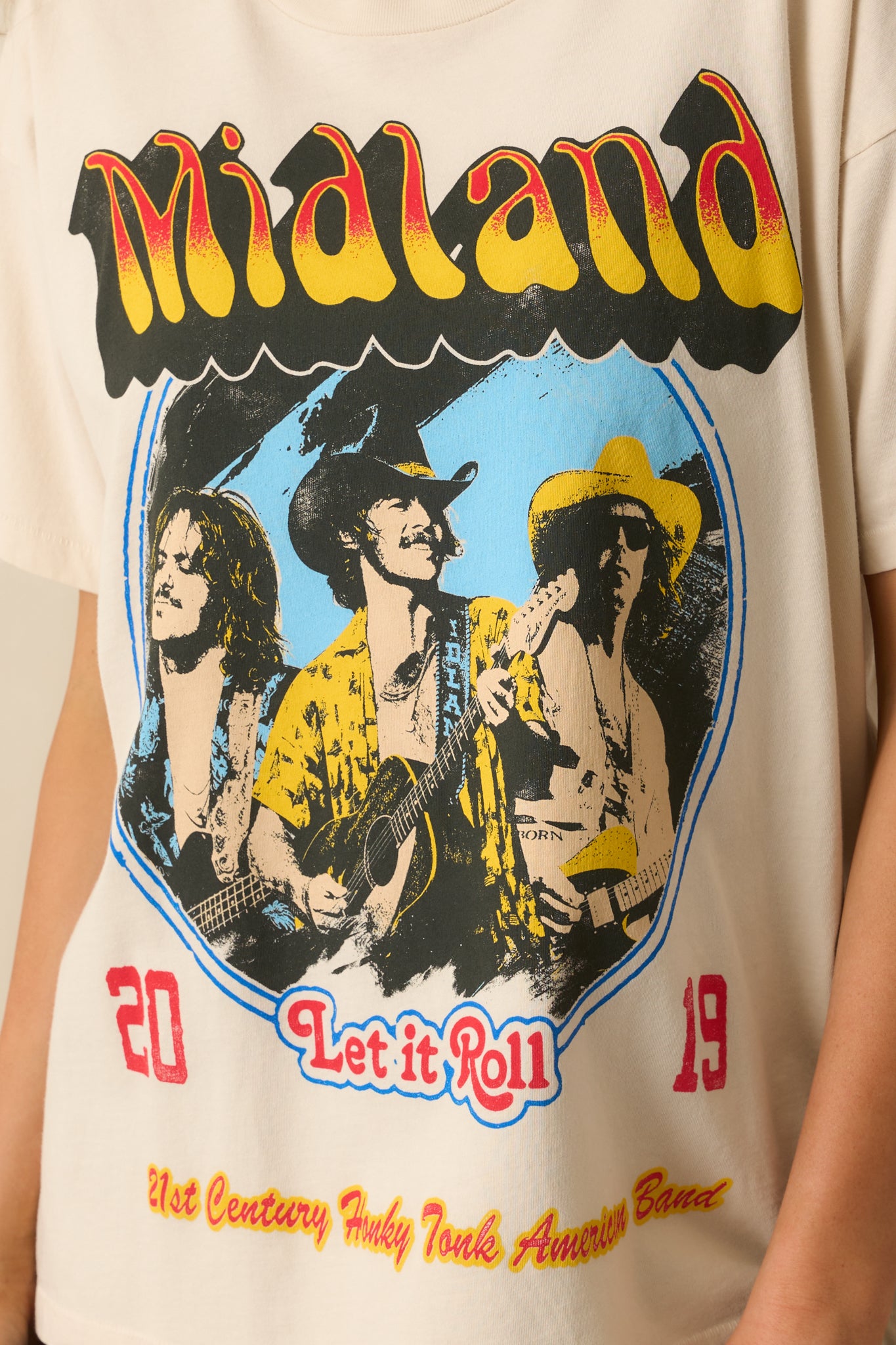 A zoomed-in shot of the Midland portrait graphic and its vibrant colors on the ivory fabric.