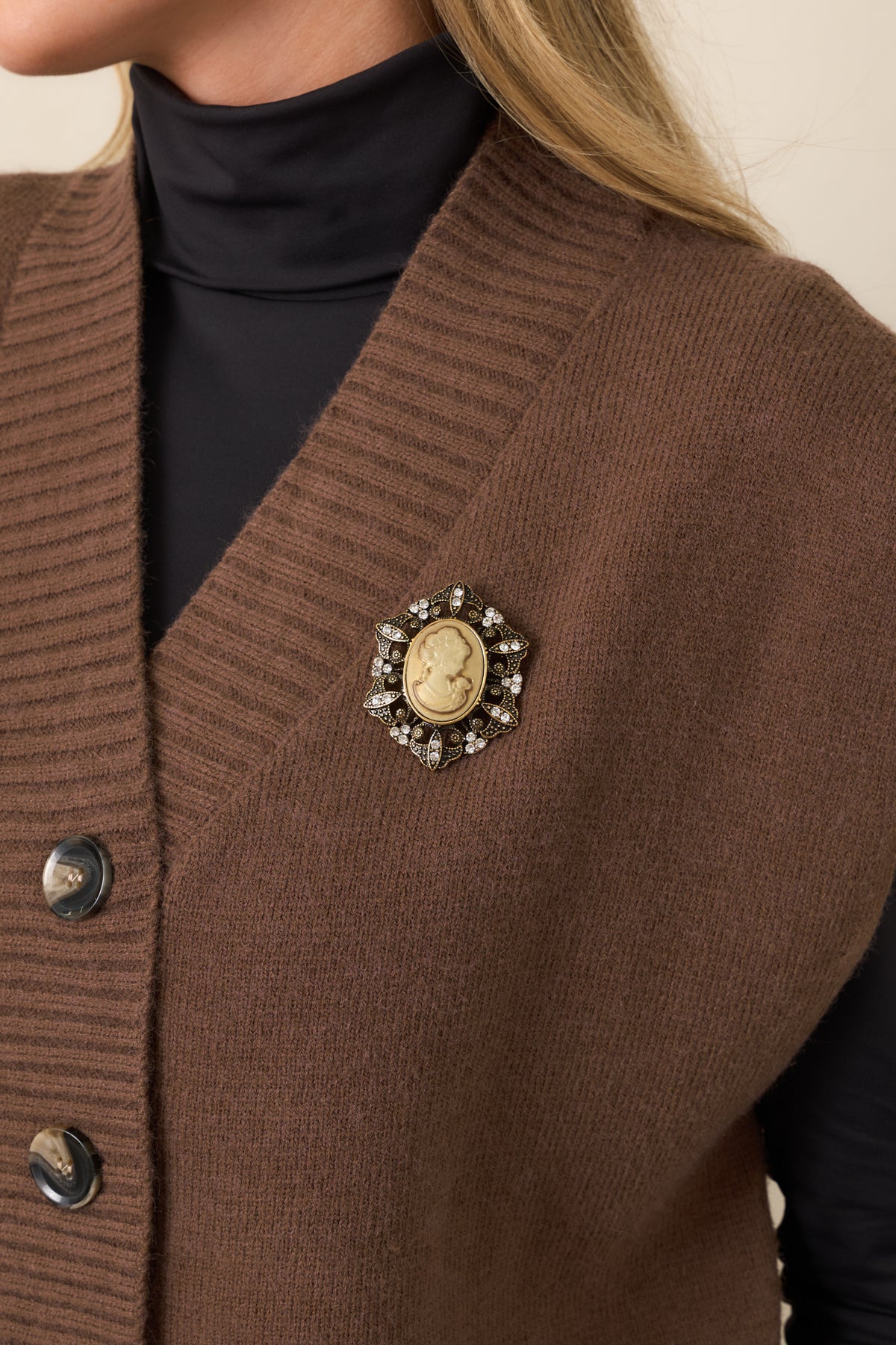 Antique finish cameo featuring an ornate frame with surrounding leaf detailing and sparkling crystal accents for an heirloom-inspired look.
