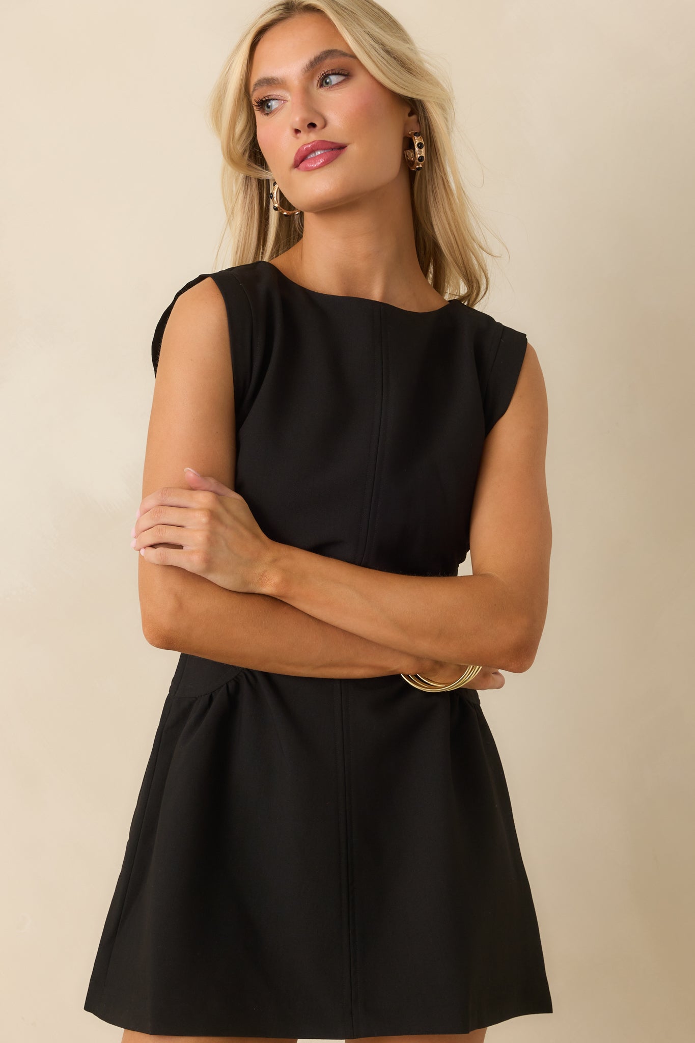 Cropped shot showcasing the smooth black fabric and tailored seams.