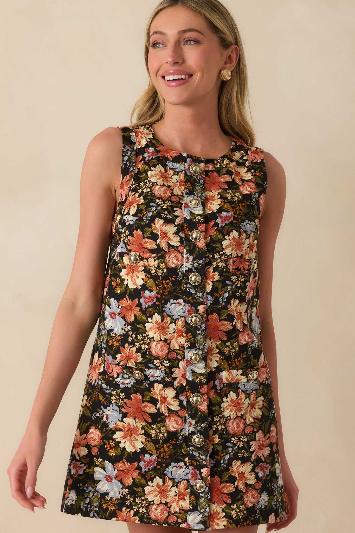 Rust-toned floral print and smooth shift-style fabric featured in close view.